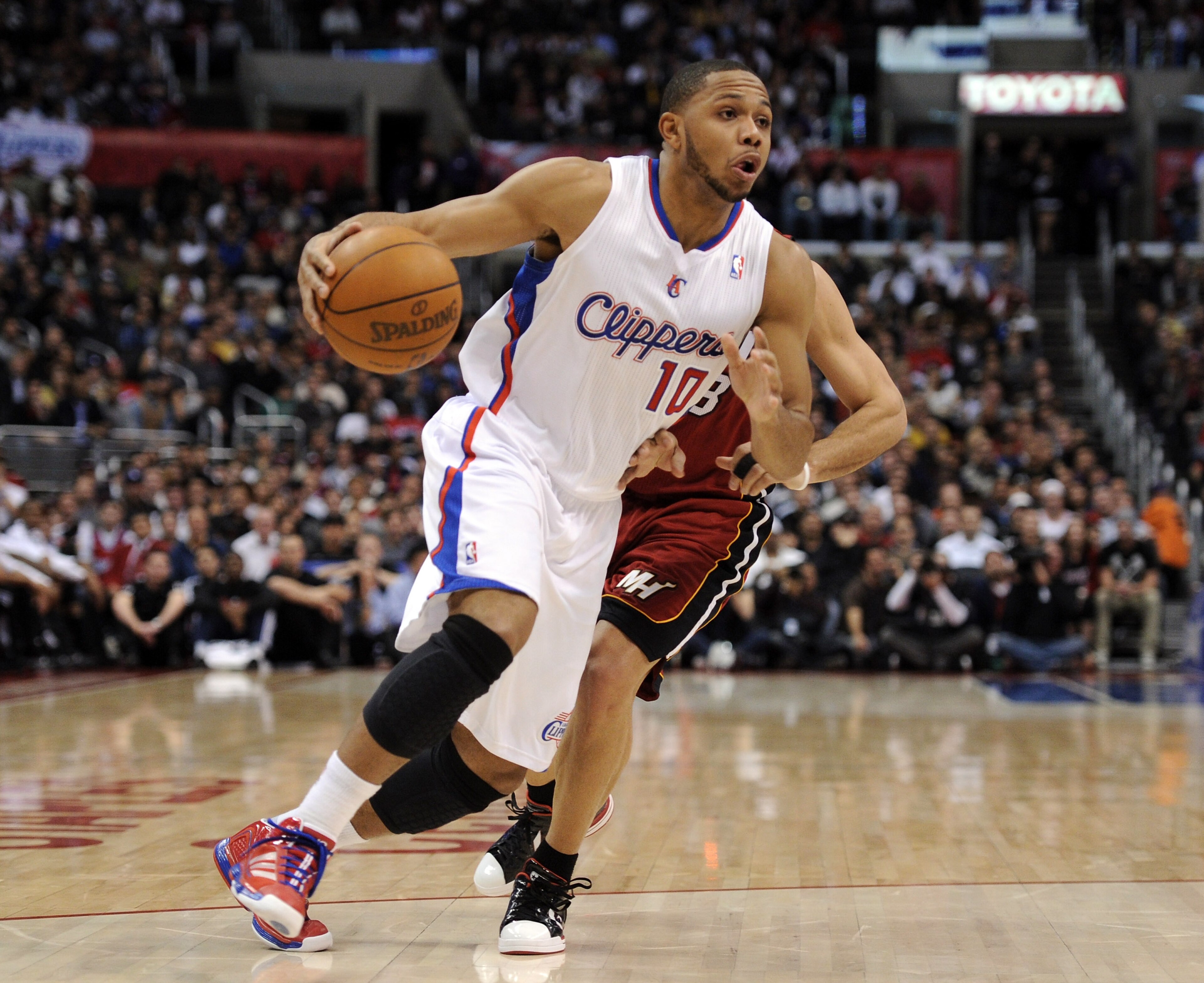 LOS ANGELES, CA - JANUARY 12: Eric Gordon #10 of the Los Angeles Clippers heads to the basket in front of Carlos Arroyo #8 of the Miami Heat at Staples Center on January 12, 2011 in Los Angeles, California. NOTE TO USER: User expressly acknowledges and LOS ANGELES, CA - JANUARY 12: Eric Gordon #10 of the Los Angeles Clippers heads to the basket in front of Carlos Arroyo #8 of the Miami Heat at Staples Center on January 12, 2011 in Los Angeles, California. NOTE TO USER: User expressly acknowledges and