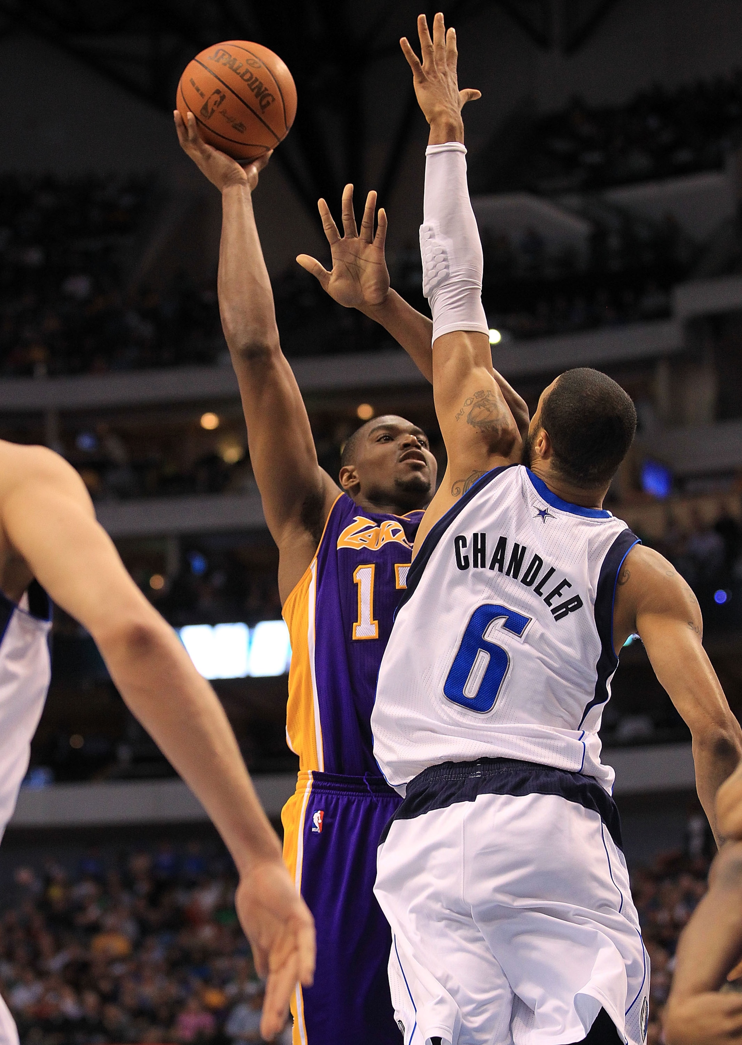 DALLAS, TX - MARCH 12:  Center Andrew Bynum #17 of the Los Angeles Lakers takes a shot against Tyson Chandler #6 of the Dallas Mavericks at American Airlines Center on March 12, 2011 in Dallas, Texas.  NOTE TO USER: User expressly acknowledges and agrees