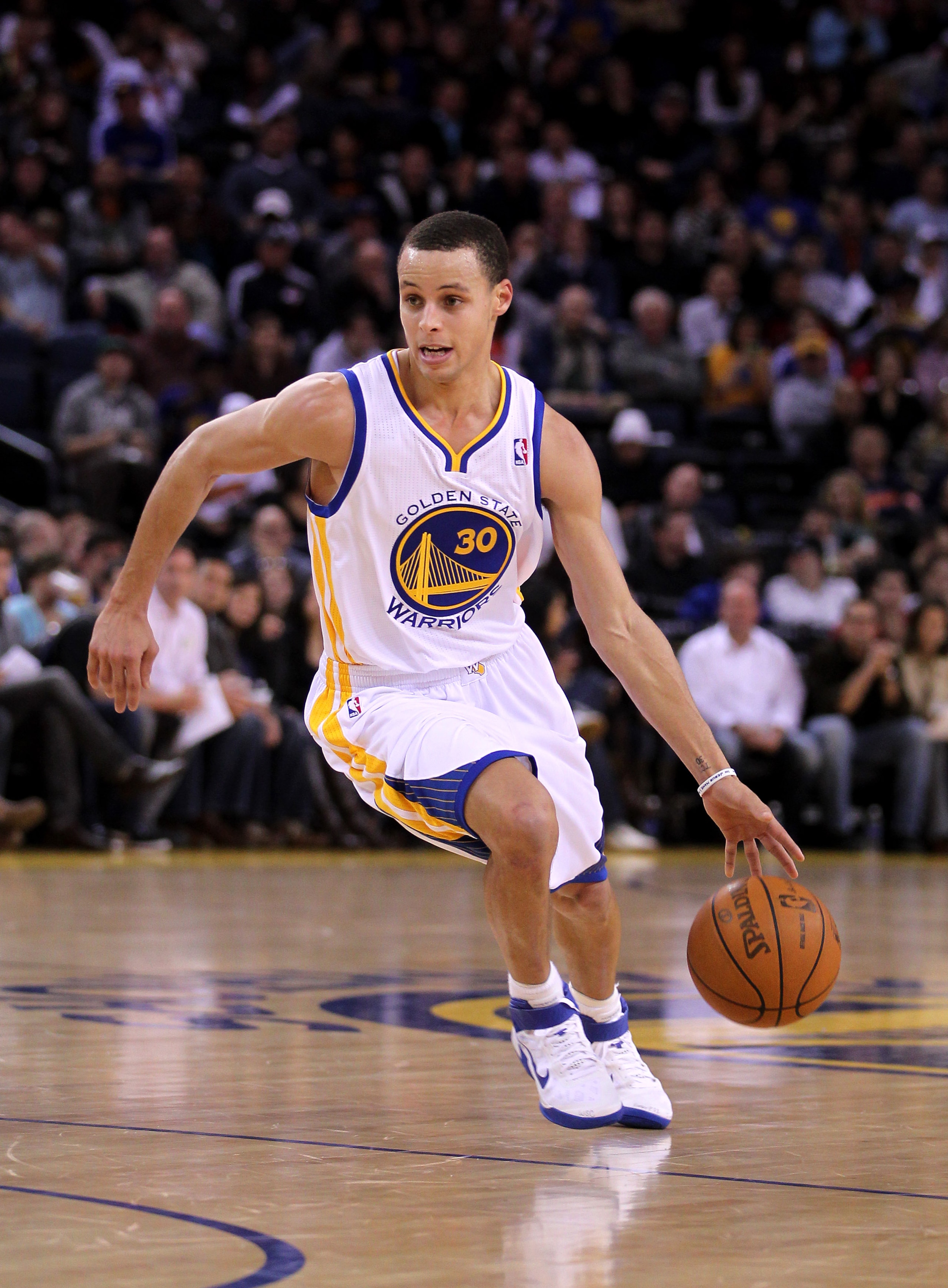OAKLAND, CA - MARCH 25:  Stephen Curry #30 of the Golden State Warriors in action against the Toronto Raptors at Oracle Arena on March 25, 2011 in Oakland, California. NOTE TO USER: User expressly acknowledges and agrees that, by downloading and or using