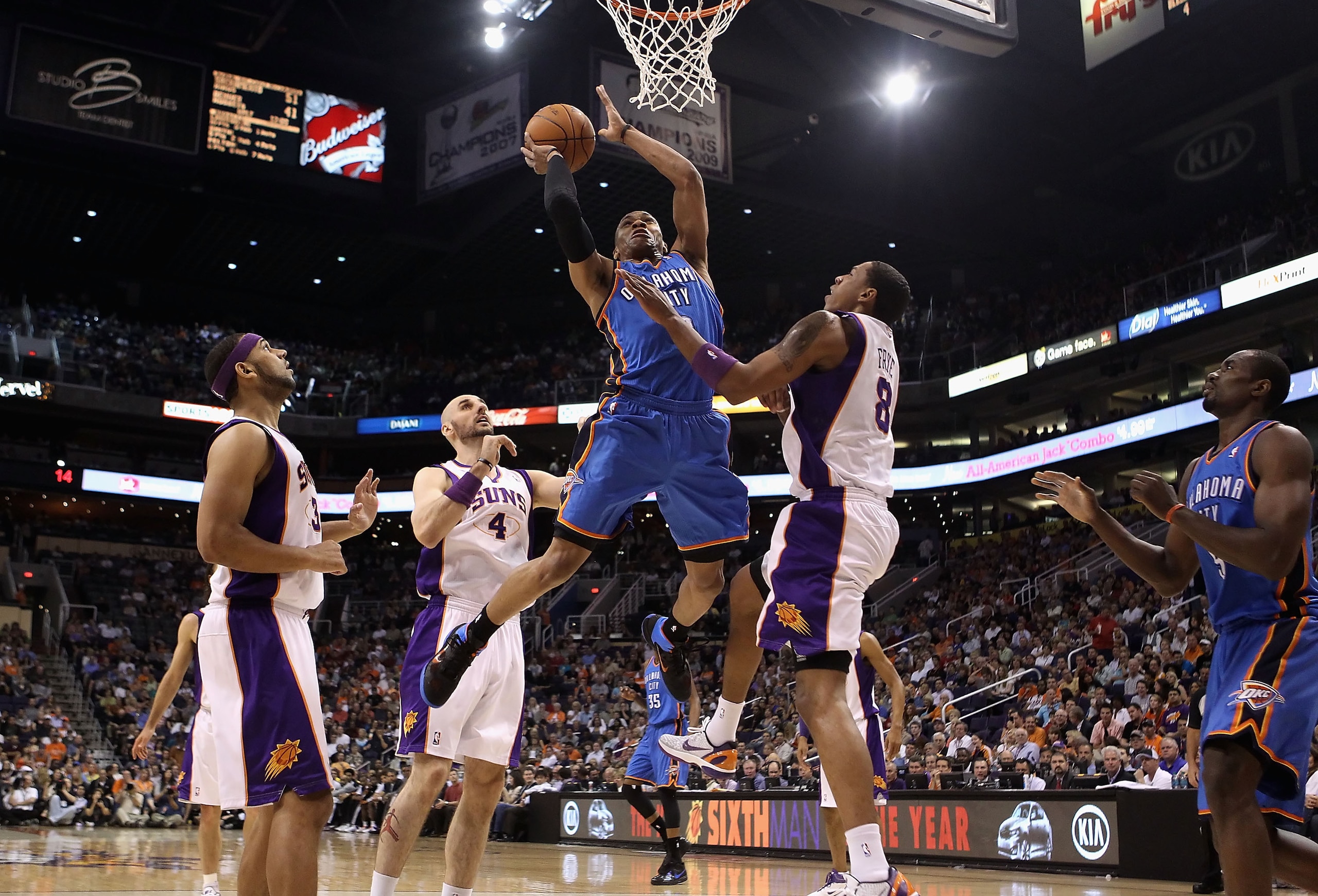 PHOENIX, AZ - MARCH 30:  Russell Westbrook #0 of the Oklahoma City Thunder puts up a shot over Channing Frye #8 of the Phoenix Suns during the NBA game at US Airways Center on March 30, 2011 in Phoenix, Arizona.  NOTE TO USER: User expressly acknowledges