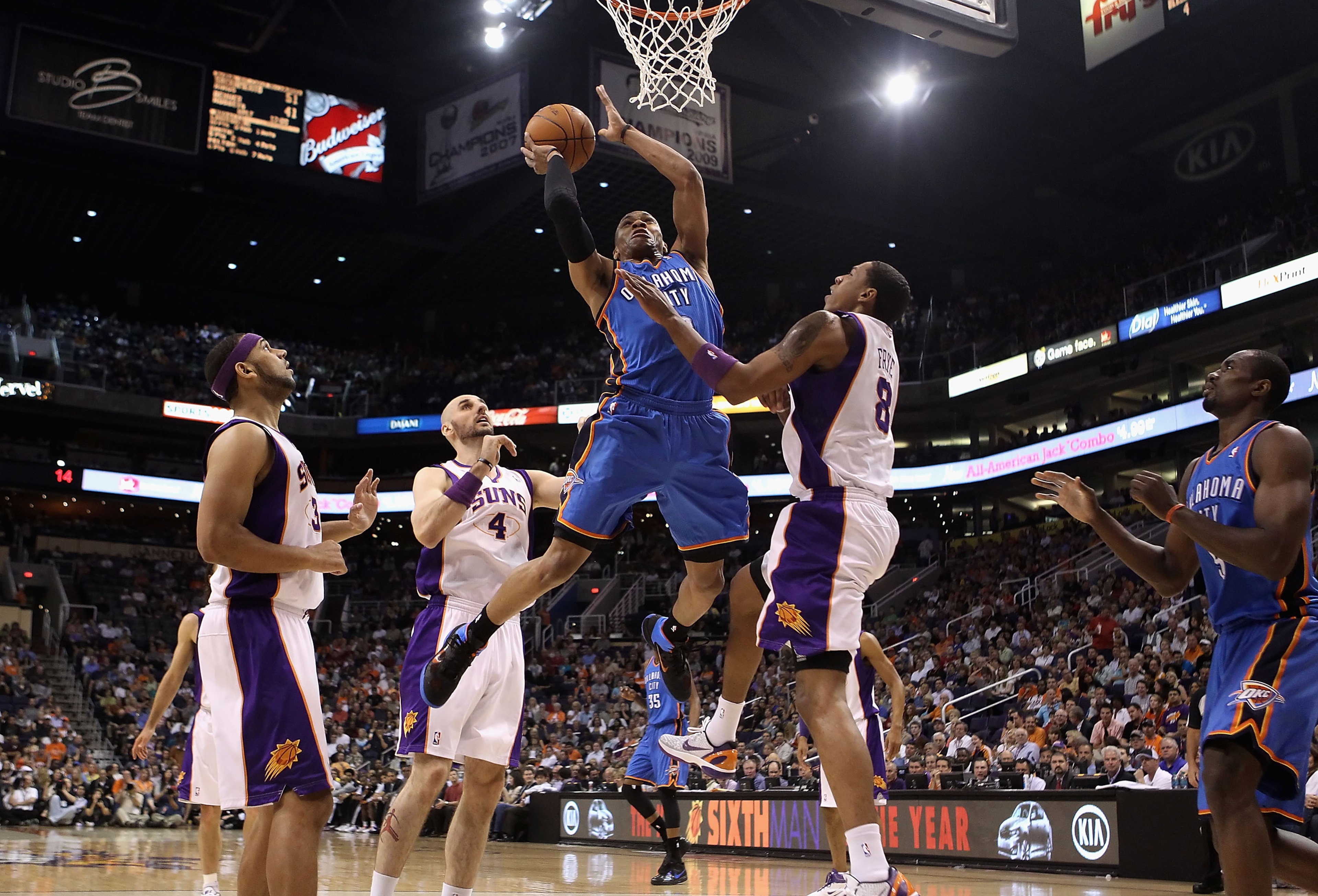 PHOENIX, AZ - MARCH 30: Russell Westbrook #0 of the Oklahoma City Thunder puts up a shot over Channing Frye #8 of the Phoenix Suns during the NBA game at US Airways Center on March 30, 2011 in Phoenix, Arizona. NOTE TO USER: User expressly acknowledges PHOENIX, AZ - MARCH 30: Russell Westbrook #0 of the Oklahoma City Thunder puts up a shot over Channing Frye #8 of the Phoenix Suns during the NBA game at US Airways Center on March 30, 2011 in Phoenix, Arizona. NOTE TO USER: User expressly acknowledges