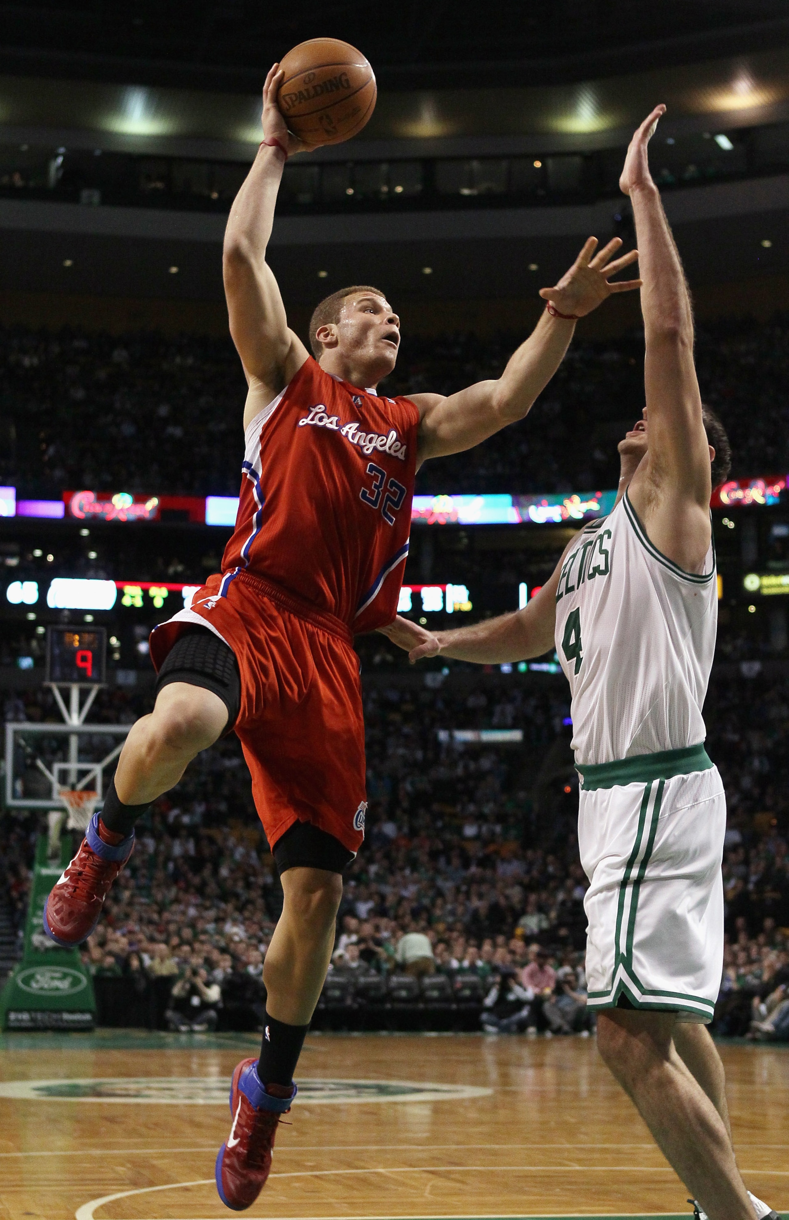 BOSTON, MA - MARCH 09:  Blake Griffin #32 of the Los Angeles Clippers takes a shot as Nenad Krstic #4 of the Boston Celtics defends on March 9, 2011 at the TD Garden in Boston, Massachusetts. The Los Angeles Clippers defeated the Boston Celtics 108-103. N