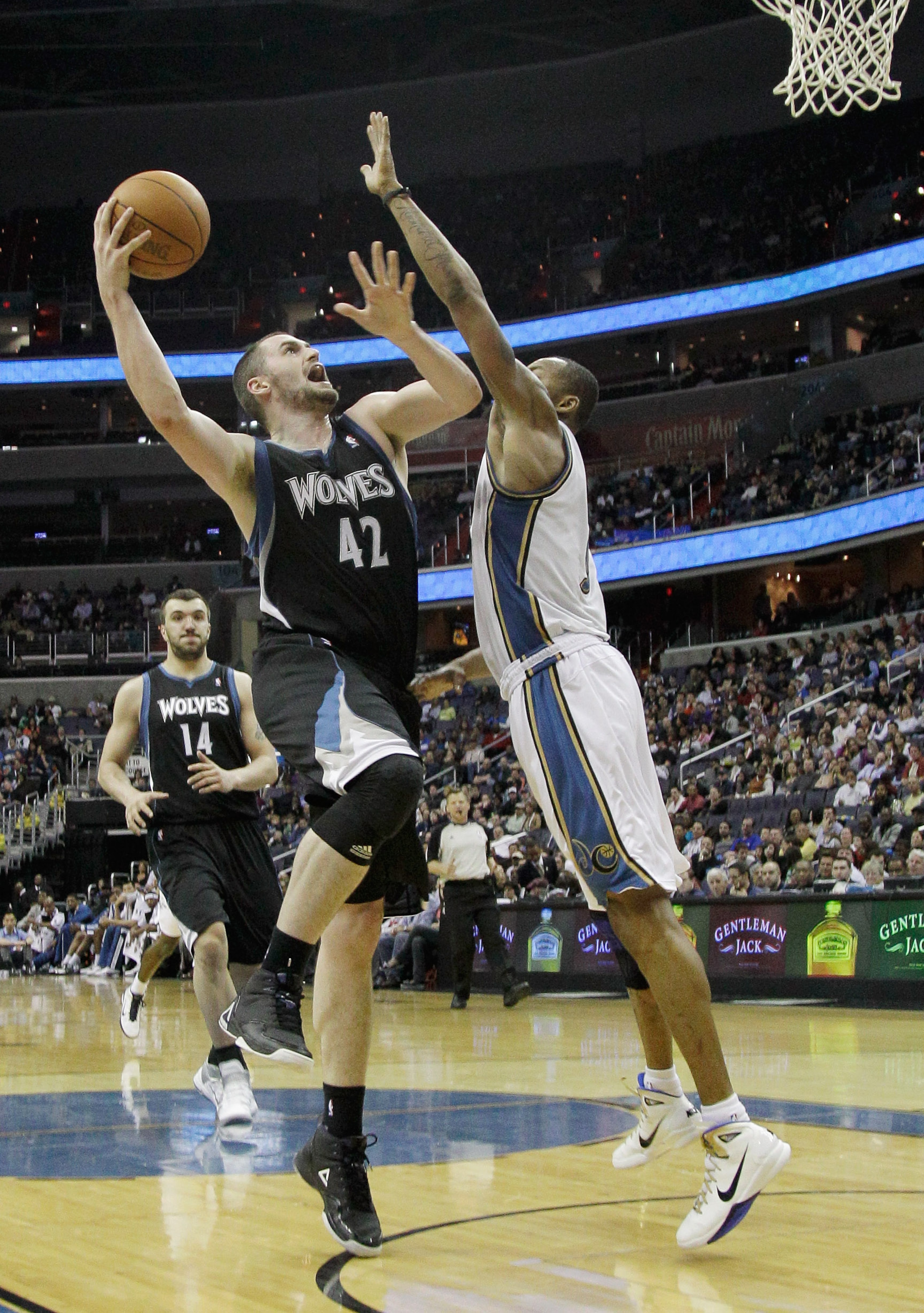 WASHINGTON, DC - MARCH 05: Kevin Love #42 of the Minnesota Timberwolves puts up a shot over the defense of Rashard Lewis #9 of the Washington Wizards at the Verizon Center on March 5, 2011 in Washington, DC. NOTE TO USER: User expressly acknowledges and WASHINGTON, DC - MARCH 05: Kevin Love #42 of the Minnesota Timberwolves puts up a shot over the defense of Rashard Lewis #9 of the Washington Wizards at the Verizon Center on March 5, 2011 in Washington, DC. NOTE TO USER: User expressly acknowledges and