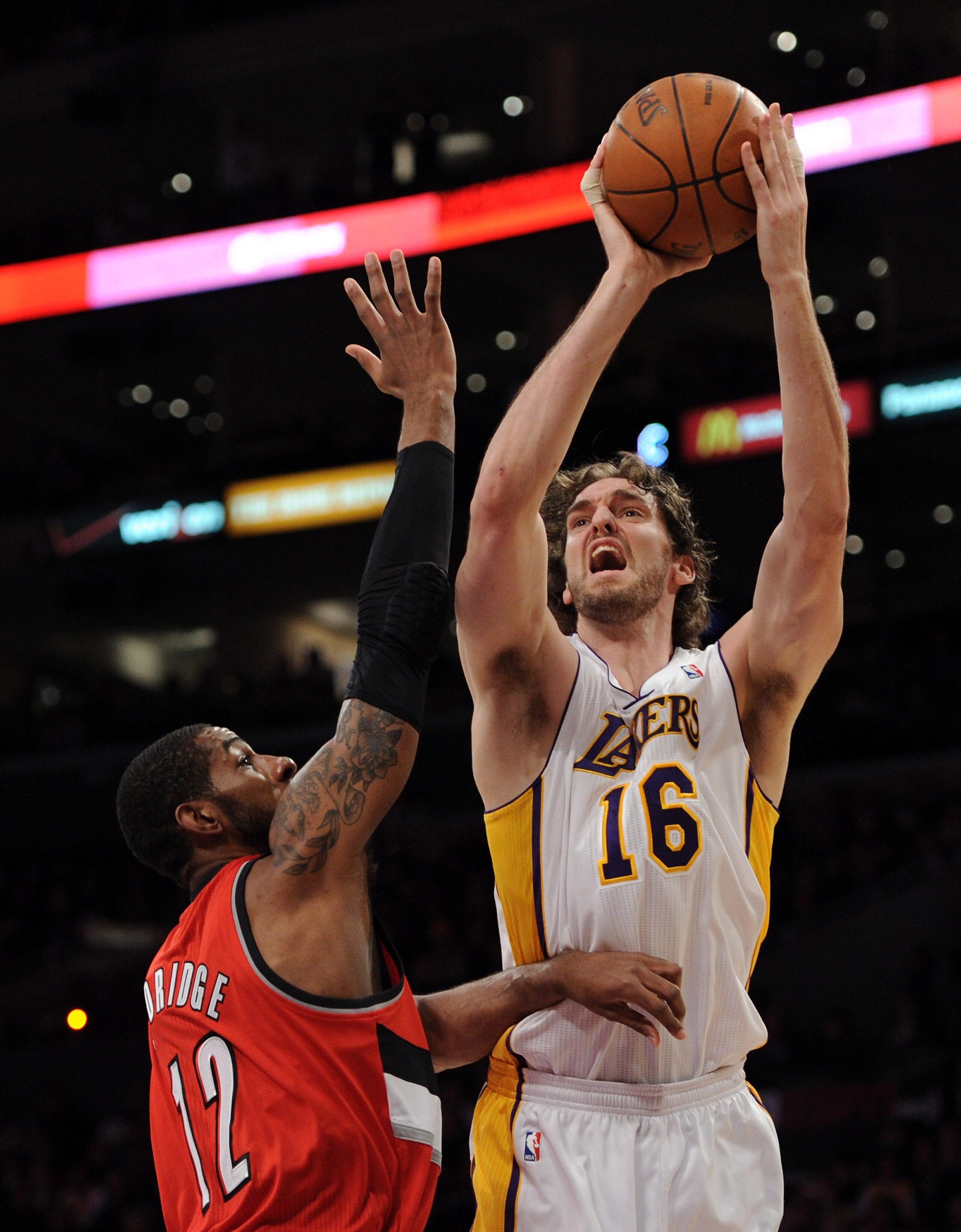 LOS ANGELES, CA - MARCH 20:  Pau Gasol #16 of the Los Angeles Lakers shoots a jumper in front of LaMarcus Aldridge #12 of the Portland Trail Blazers at the Staples Center on March 20, 2011 in Los Angeles, California.  NOTE TO USER: User expressly acknowle