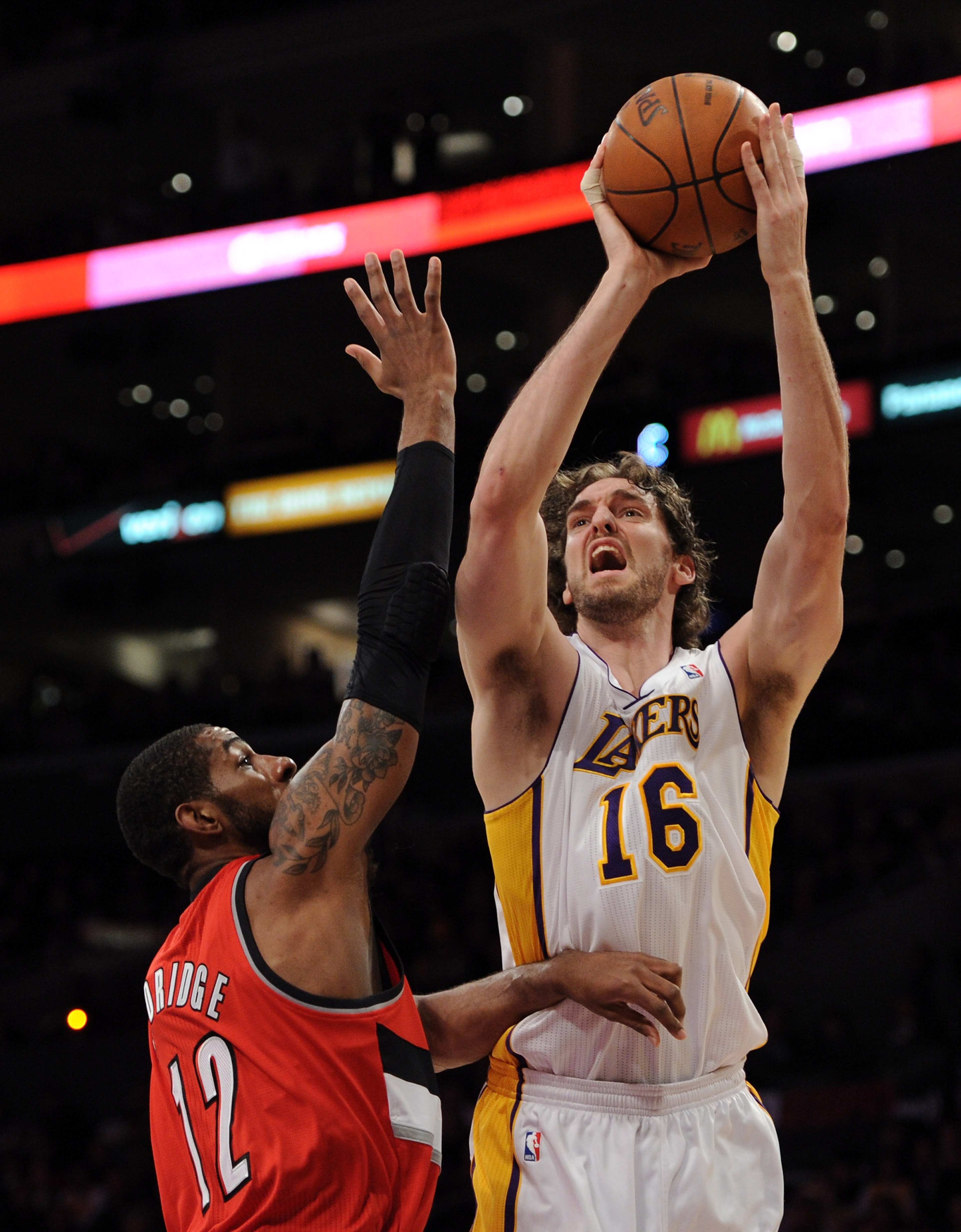 LOS ANGELES, CA - MARCH 20: Pau Gasol #16 of the Los Angeles Lakers shoots a jumper in front of LaMarcus Aldridge #12 of the Portland Trail Blazers at the Staples Center on March 20, 2011 in Los Angeles, California. NOTE TO USER: User expressly acknowle LOS ANGELES, CA - MARCH 20: Pau Gasol #16 of the Los Angeles Lakers shoots a jumper in front of LaMarcus Aldridge #12 of the Portland Trail Blazers at the Staples Center on March 20, 2011 in Los Angeles, California. NOTE TO USER: User expressly acknowle