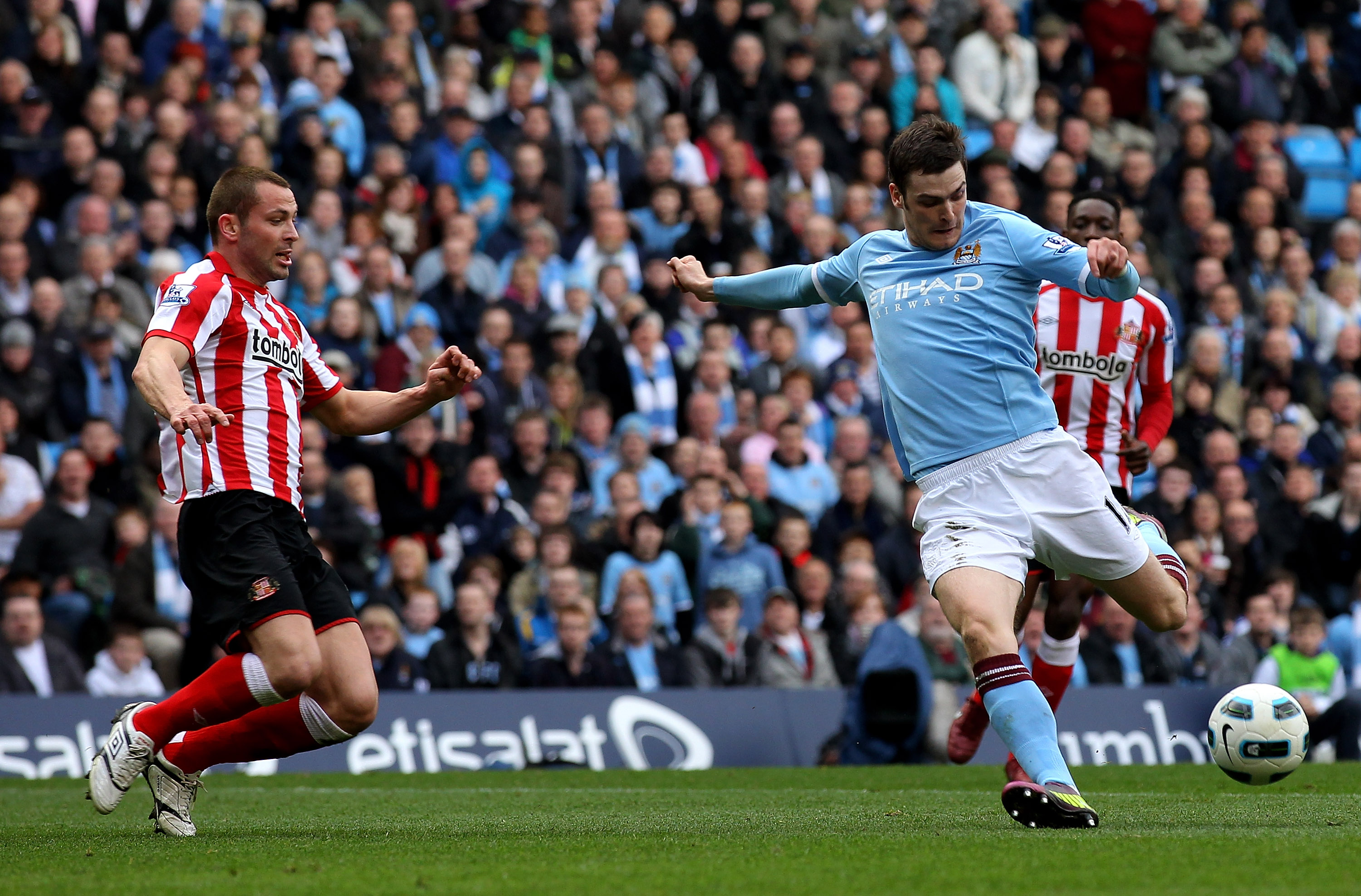 MANCHESTER, ENGLAND - APRIL 03:  Adam Johnson of Manchester City scores the opening goal during the Barclays Premier League match between Manchester City and Sunderland at the City of Manchester Stadium on April 3, 2011 in Manchester, England.  (Photo by 
