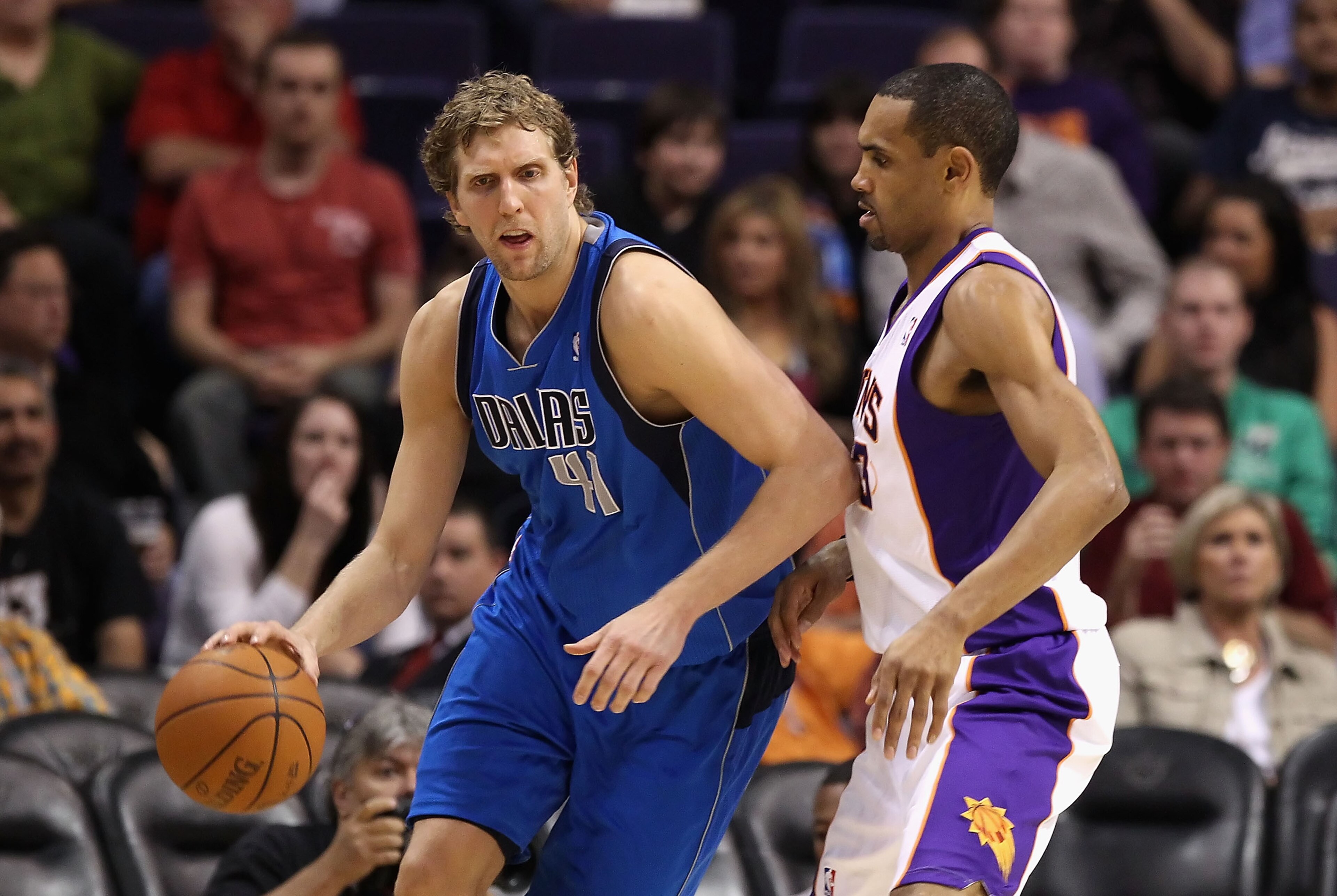 PHOENIX, AZ - MARCH 27: Dirk Nowitzki #41 of the Dallas Mavericks handles the ball during the NBA game against the Phoenix Suns at US Airways Center on March 27, 2011 in Phoenix, Arizona. The Mavericks defeated the Suns 91-83. NOTE TO USER: User expres PHOENIX, AZ - MARCH 27: Dirk Nowitzki #41 of the Dallas Mavericks handles the ball during the NBA game against the Phoenix Suns at US Airways Center on March 27, 2011 in Phoenix, Arizona. The Mavericks defeated the Suns 91-83. NOTE TO USER: User expres