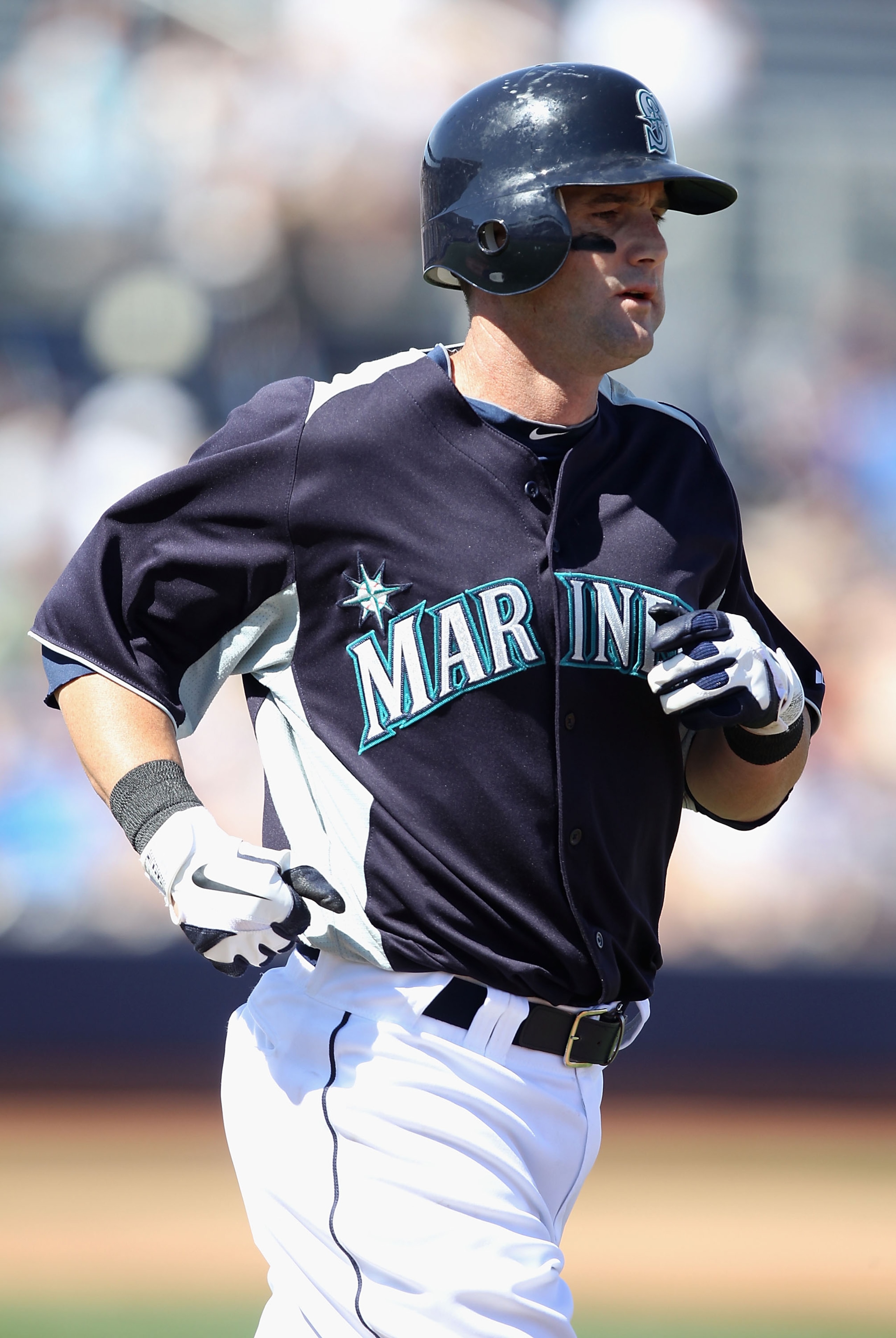 PEORIA, AZ - MARCH 12:  Adam Kennedy #4 of the Seattle Mariners draws a walk during the spring training game against the Oakland Athletics at Peoria Stadium on March 12, 2011 in Peoria, Arizona.  (Photo by Christian Petersen/Getty Images)