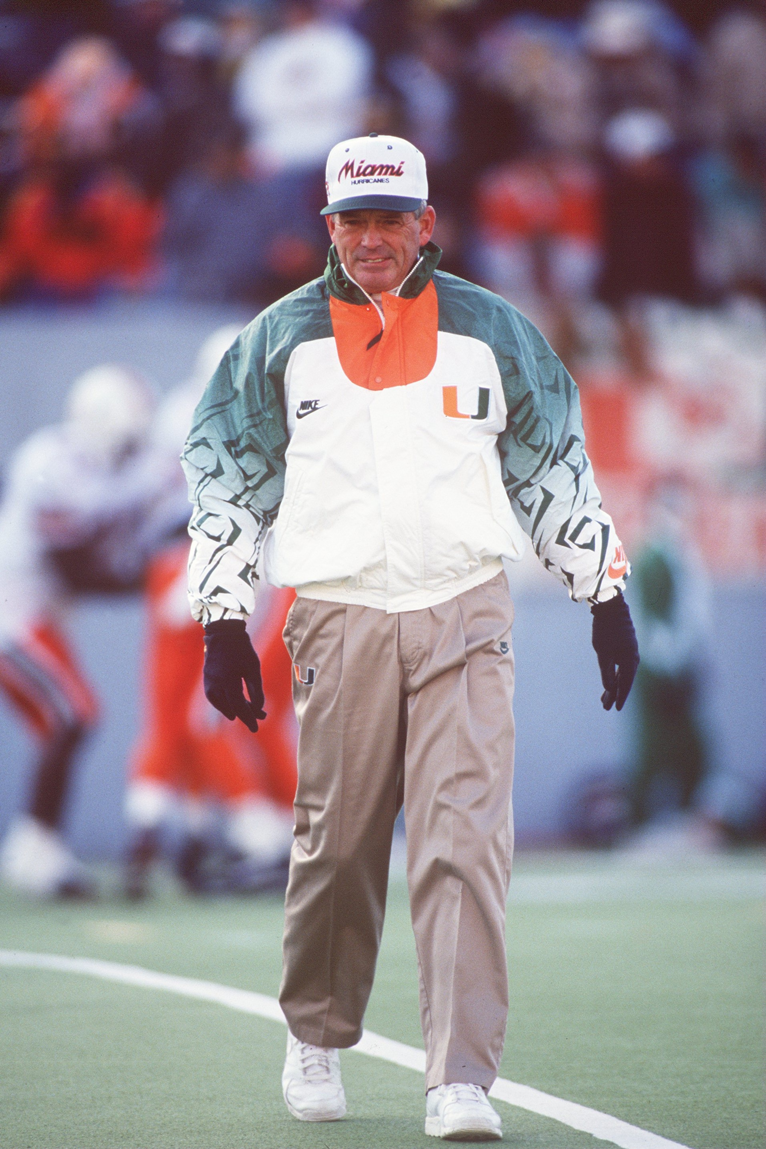 20 NOV 1993:  UNIVERSITY OF MIAMI HEAD COACH DENNIS ERICKSON WALKS OFF THE FIELD DURING THE HURRICANES 17-14 LOSS TO THE UNIVERSITY OF WEST VIRGINIA MOUNTAINEERS AT MOUNTAINEER FIELD IN MORGANTOWN, WEST VIRGINIA. Mandatory Credit: Doug Pensinger/ALLSPORT