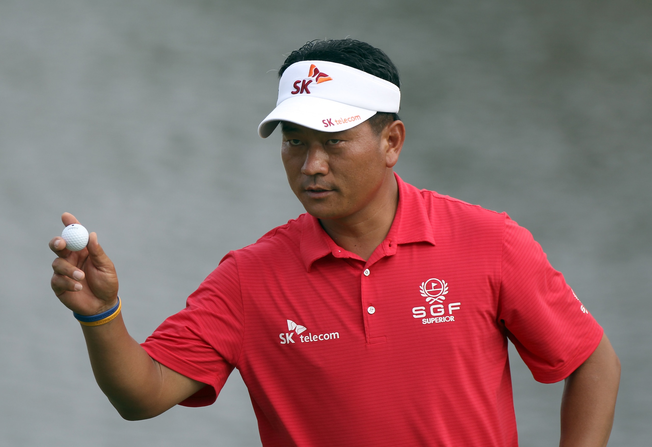 ORLANDO, FL - MARCH 26:  K.J. Choi of Korea acknowledges the crowd during the third round of the Arnold Palmer Invitational presented by MasterCard at the Bay Hill Club and Lodge on March 26, 2011 in Orlando, Florida.  (Photo by Sam Greenwood/Getty Images