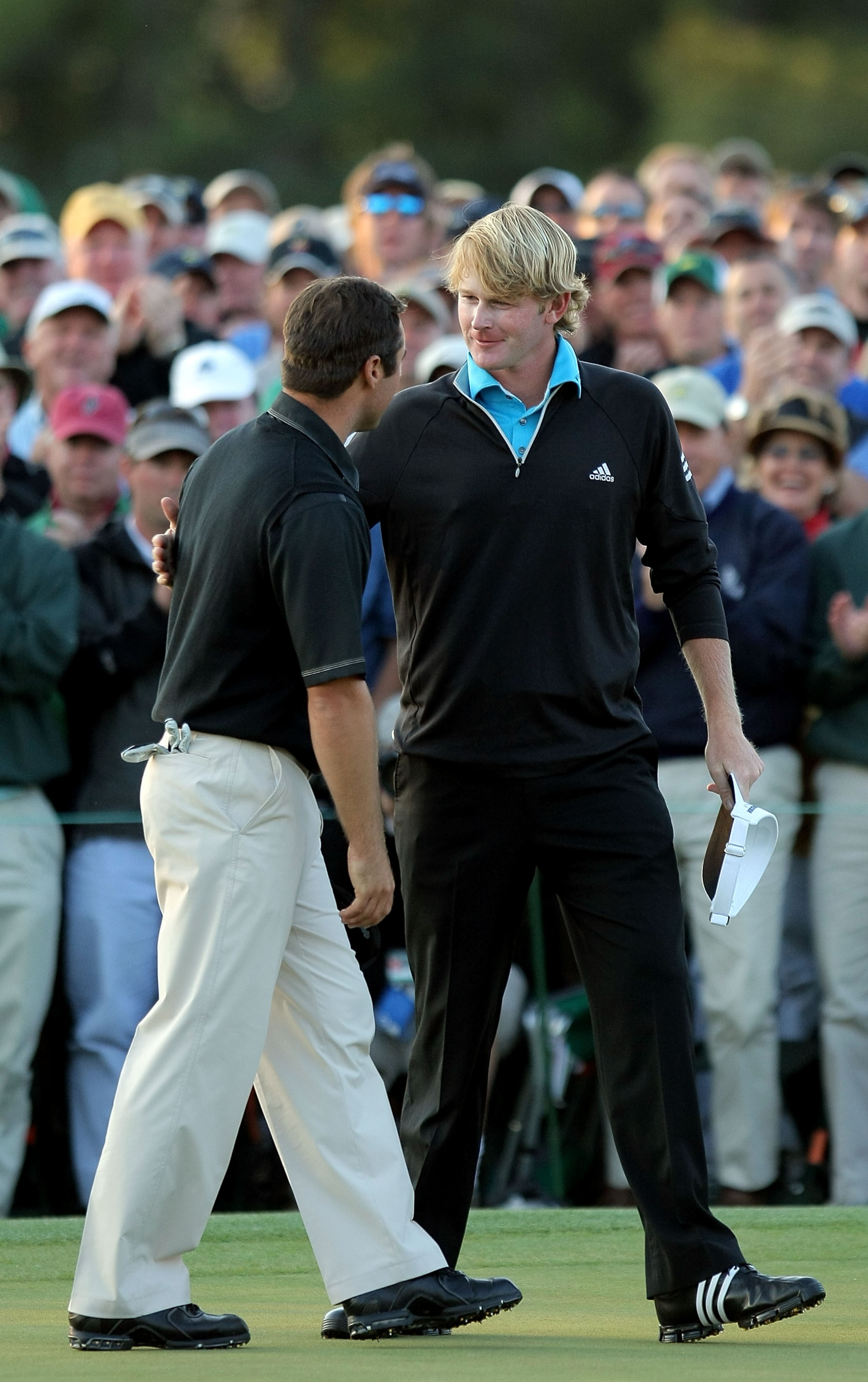 AUGUSTA, GA - APRIL 13:  Trevor Immelman of South Africa walks to the 18th green alongside Brandt Snedeker during the final round of the 2008 Masters Tournament at Augusta National Golf Club on April 13, 2008 in Augusta, Georgia.  (Photo by Harry How/Gett