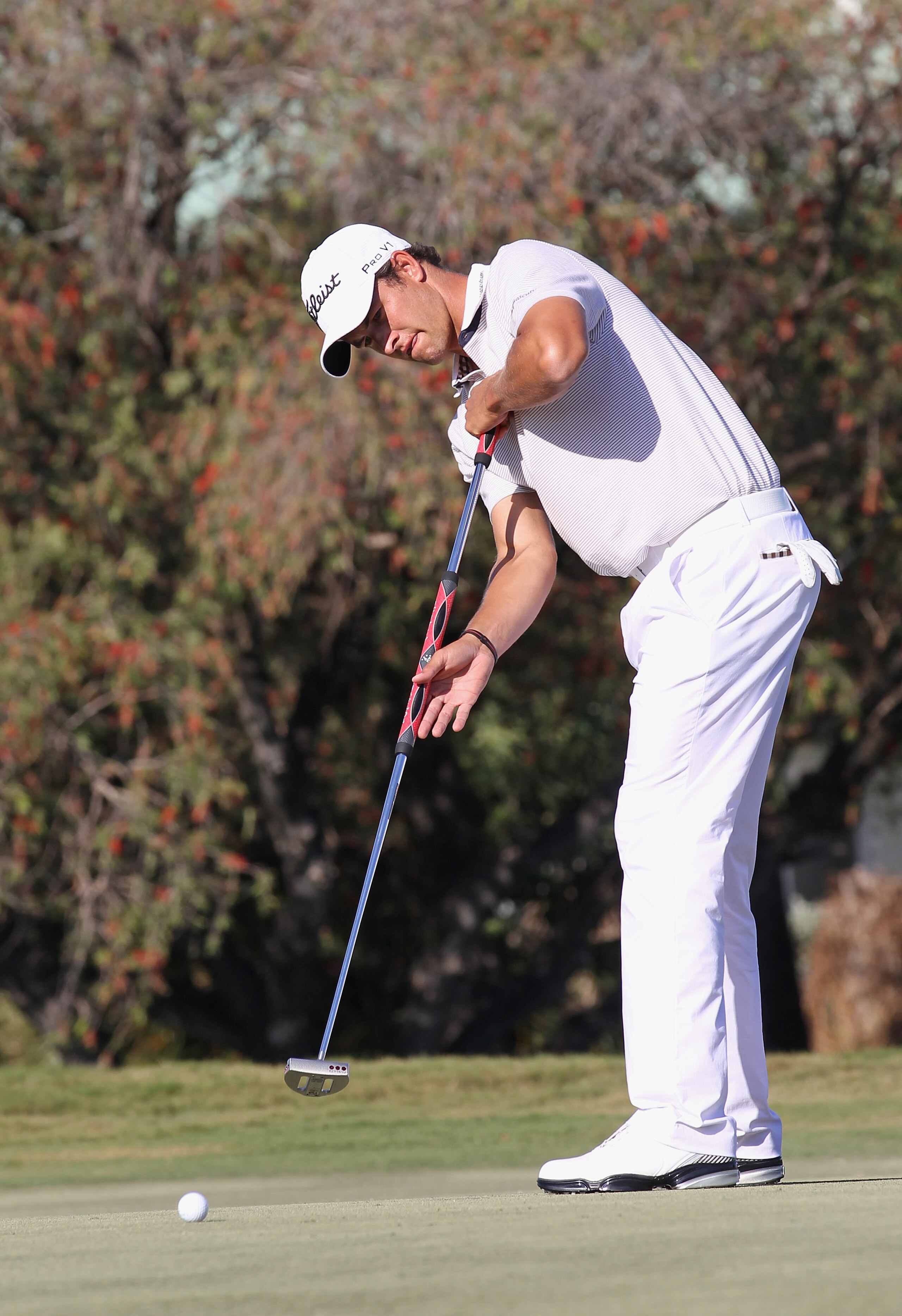 DORAL, FL - MARCH 13:  Adam Scott of Australia hits a putt during the final round of the 2011 WGC- Cadillac Championship at the TPC Blue Monster at the Doral Golf Resort and Spa on March 13, 2011 in Doral, Florida.  (Photo by Sam Greenwood/Getty Images)