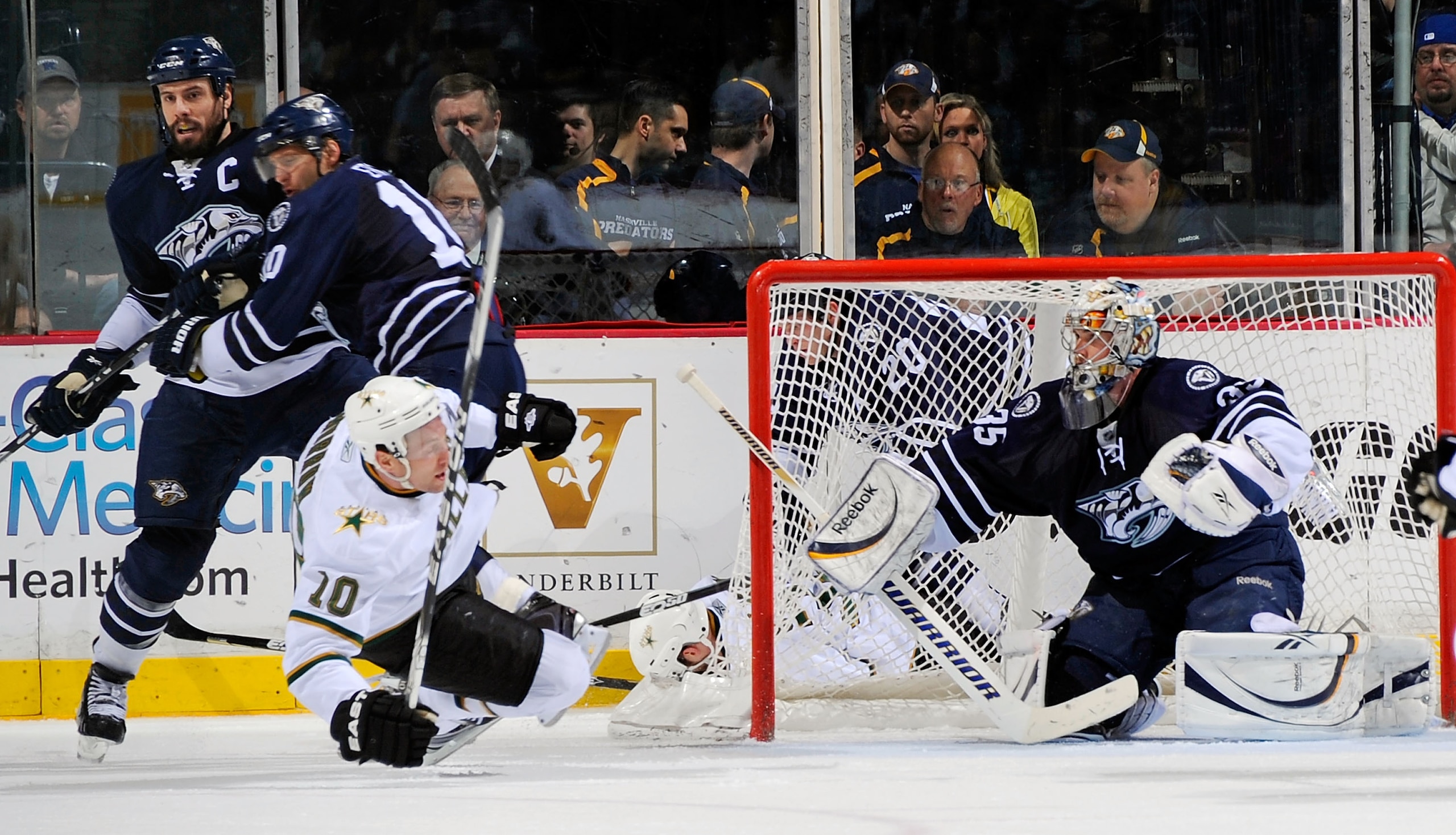 NASHVILLE, TN - MARCH 26:  Brenden Morrow #10 of the Dallas Stars falls in front of Shea Weber #6, Martin Erat #10, and Pekka Rinne #35 of the Nashville Predators on March 26, 2011 at the Bridgestone Arena in Nashville, Tennessee.  (Photo by Frederick Bre