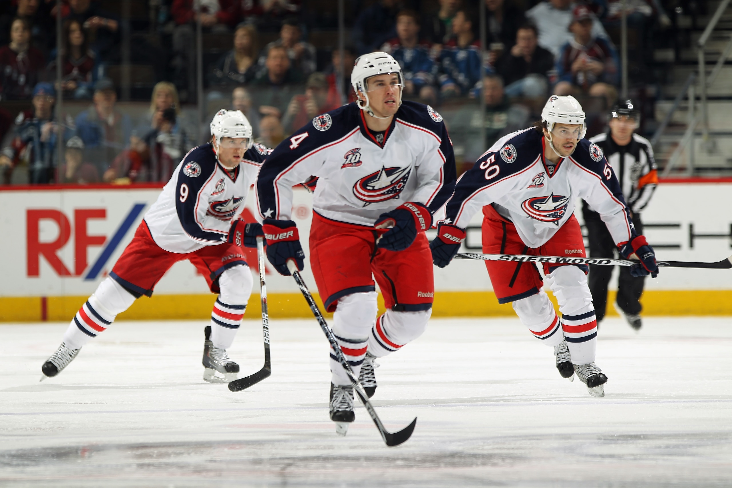 DENVER, CO - MARCH 22:  Scottie Upshall #9, Sami Lepisto #4 and Antoine Vermette #50 of the Columbus Blue Jackets skate against the Colorado Avalanche at the Pepsi Center on March 22, 2011 in Denver, Colorado. The Avalanche defeated the Blue Jackets 5-4 i