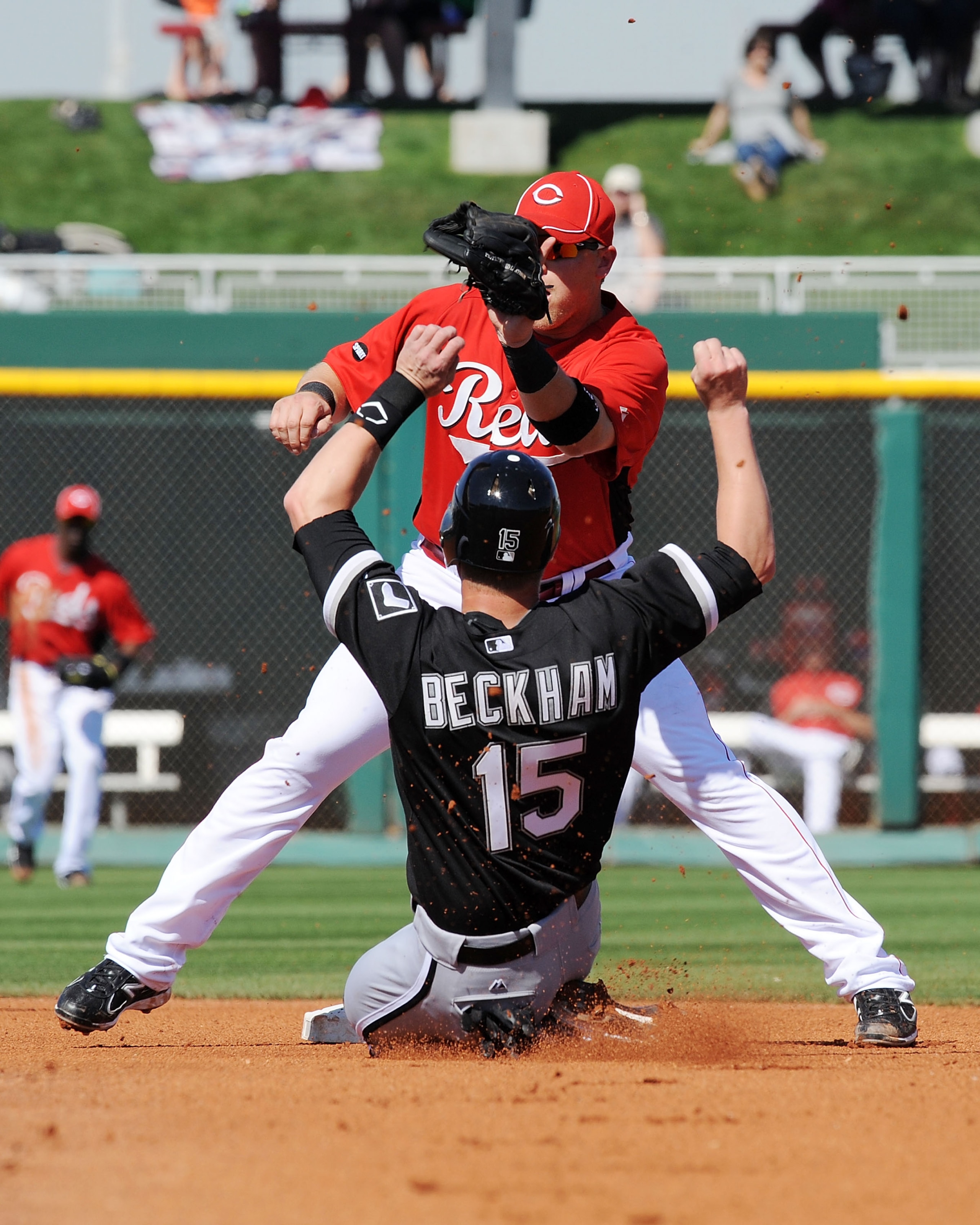 GOODYEAR, AZ - MARCH 02:  Chris Valaika #3 of the Cincinnati Reds waits for the ball as Gordon Beckham #15 of the Chicago White Sox slides into second base at Goodyear Ballpark on March 2, 2011 in Goodyear, Arizona.  (Photo by Norm Hall/Getty Images)