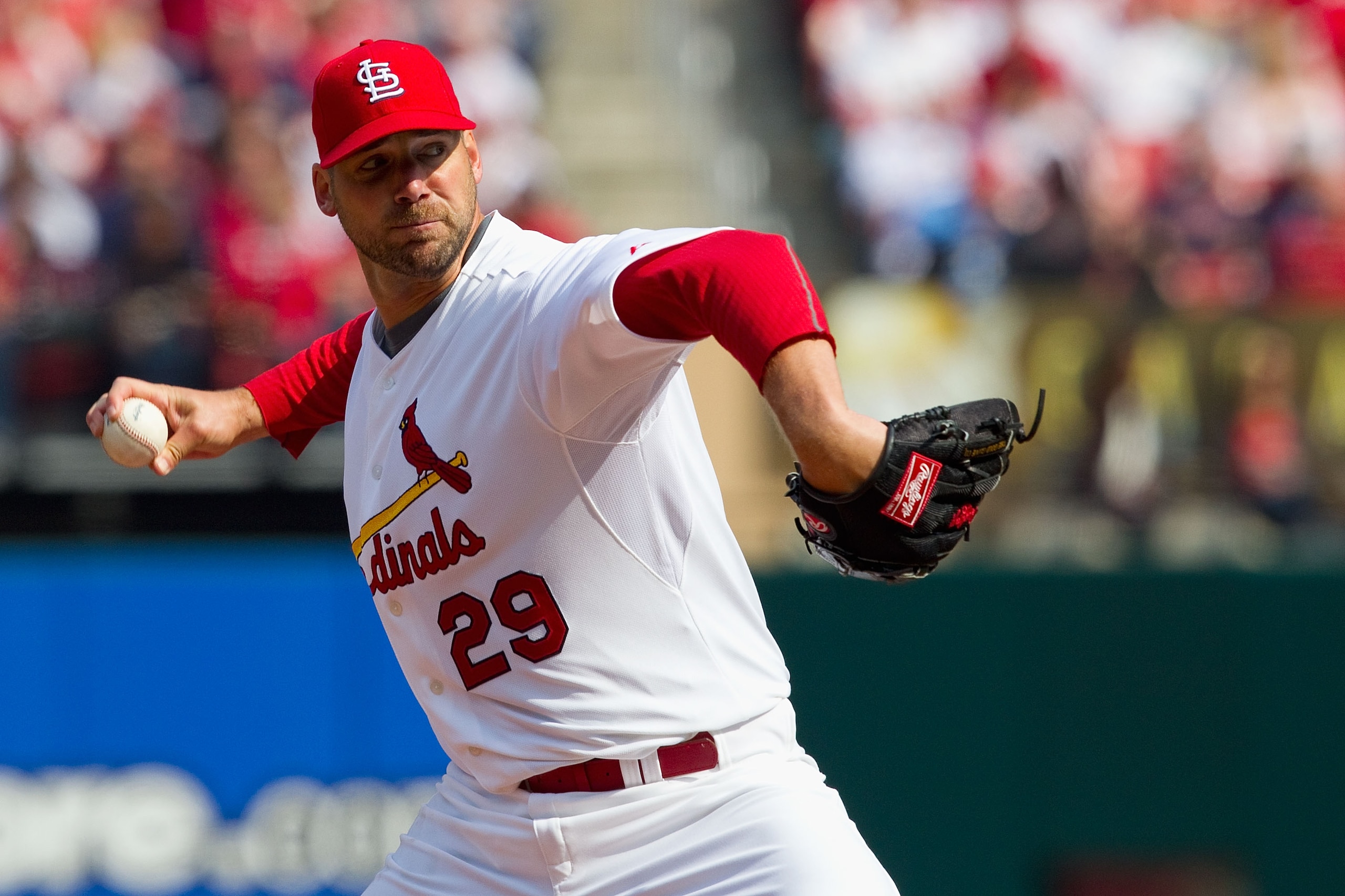ST. LOUIS, MO - MARCH 31: Starter Chris Carpenter #29 of the St. Louis Cardinals pitches against the San Diego Padres on opening day at Busch Stadium on March 31, 2011 in St. Louis, Missouri.  (Photo by Dilip Vishwanat/Getty Images)