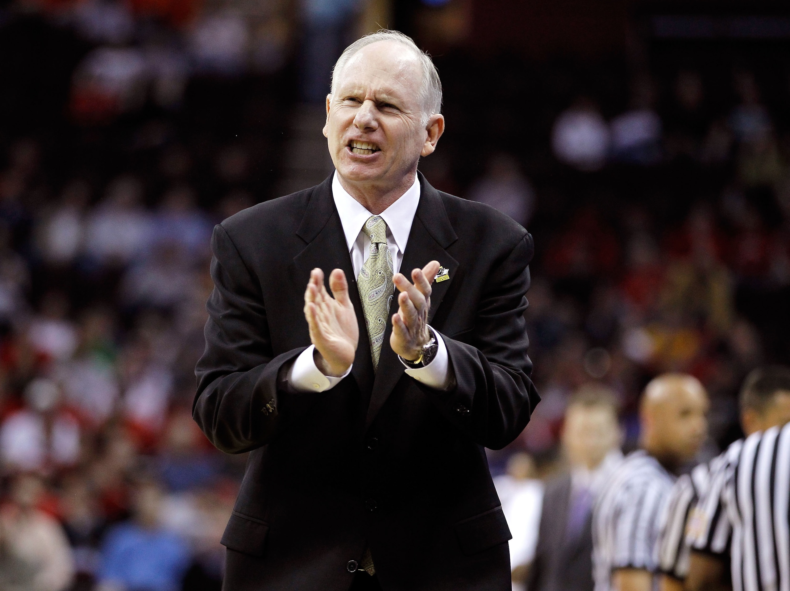 CLEVELAND, OH - MARCH 18: Head coach Jim Larranaga of the George Mason Patriots claps from the bench during the game against the Villanova Wildcats during the second round of the 2011 NCAA men's basketball tournament at Quicken Loans Arena on March 18, 20