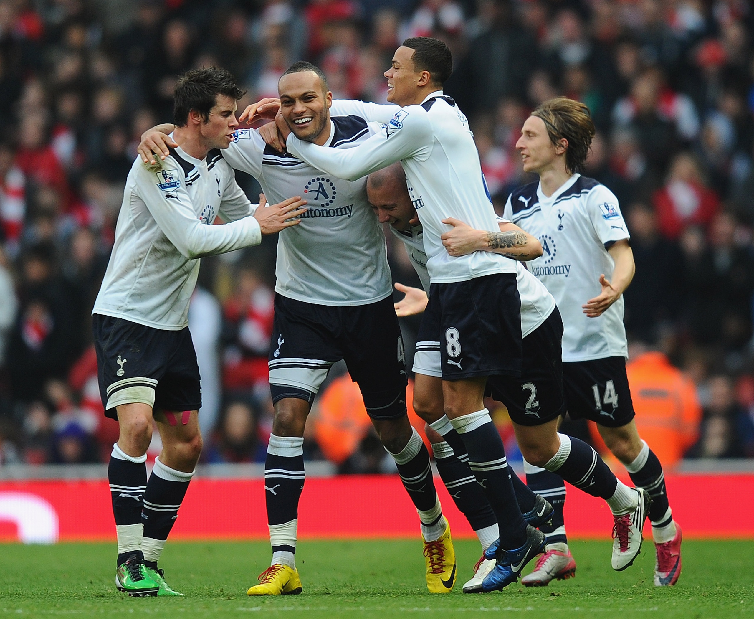 LONDON, ENGLAND - NOVEMBER 20: Younes Kaboul of Tottenham celebrates with team mates Gareth Bale, Alan Hutton and Jermaine Jenas after scoring the winner during the Barclays Premier League match between Arsenal and Tottenham Hotspur at the Emirates Stadi LONDON, ENGLAND - NOVEMBER 20: Younes Kaboul of Tottenham celebrates with team mates Gareth Bale, Alan Hutton and Jermaine Jenas after scoring the winner during the Barclays Premier League match between Arsenal and Tottenham Hotspur at the Emirates Stadi