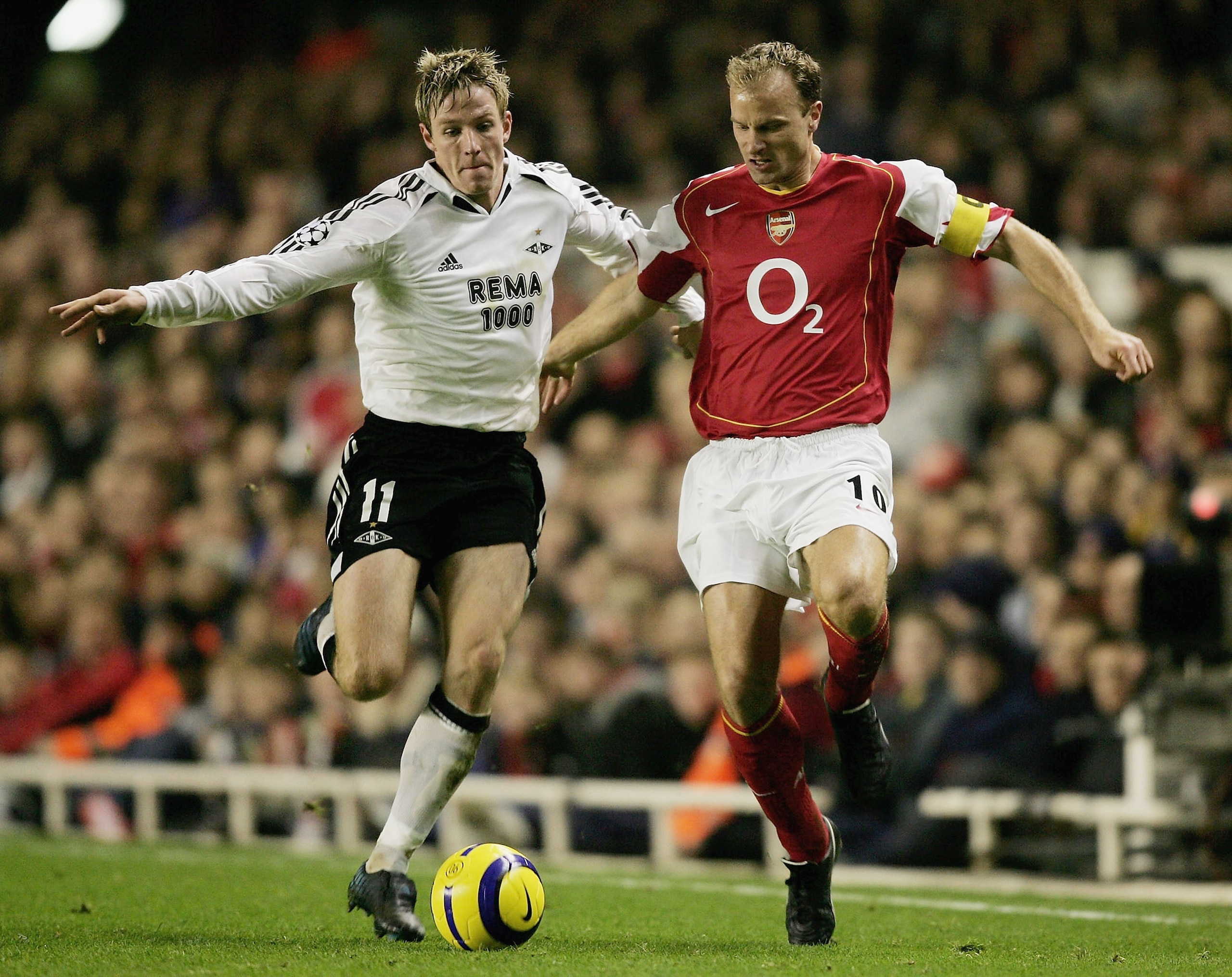 LONDON - DECEMBER 7:  Dennis Bergkamp of Arsenal battles for the ball with Jan Gunnar Solli of Rosenborg during the Champions League Group E match between Arsenal and Rosenborg at Highbury on December 7, 2004 in London, England.  (Photo by Shaun Botterill