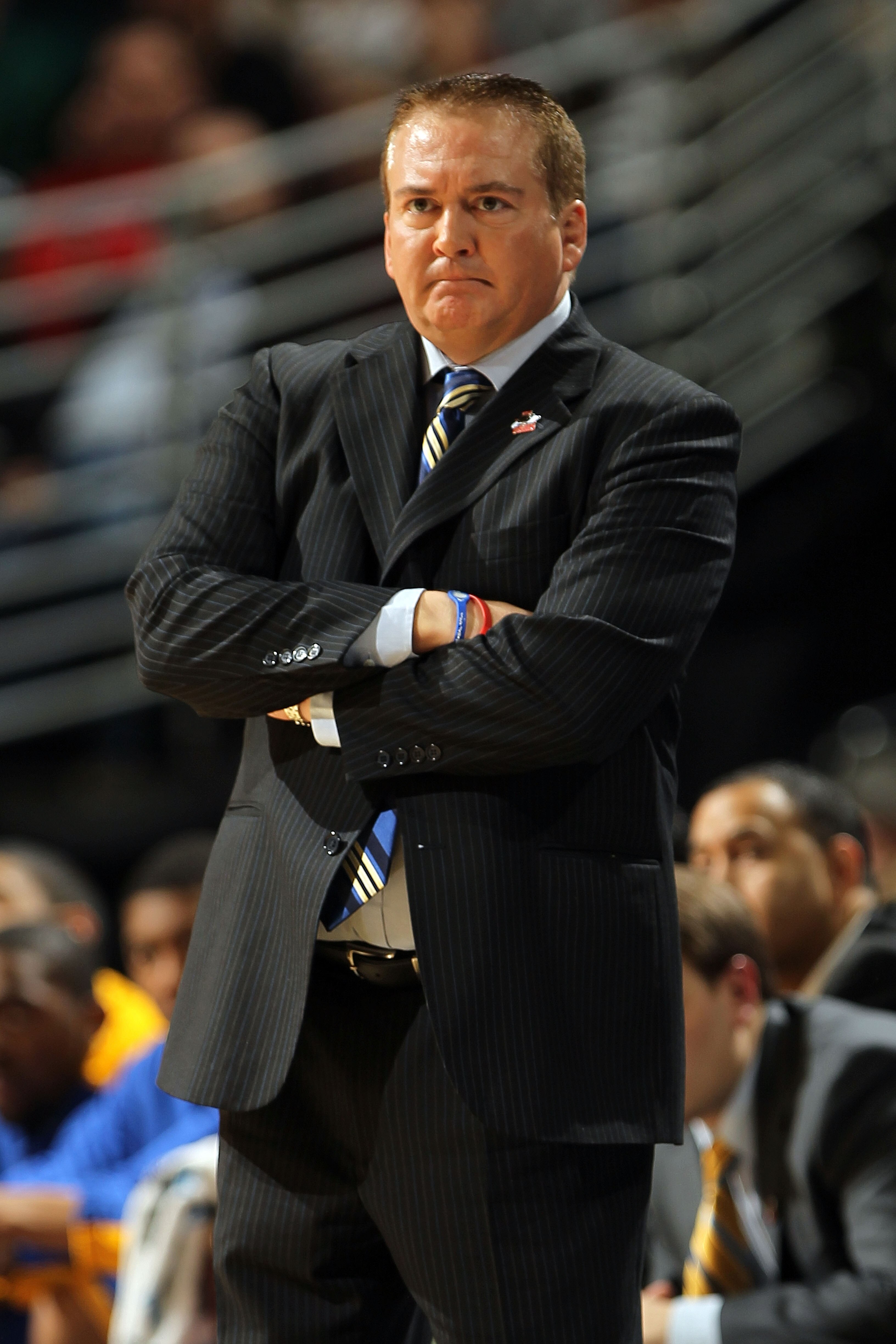 DENVER, CO - MARCH 19:  Head coach Donnie Tyndall of the Morehead State Eagles looks on from the bench against the Richmond Spiders during the third round of the 2011 NCAA men's basketball tournament at Pepsi Center on March 19, 2011 in Denver, Colorado.
