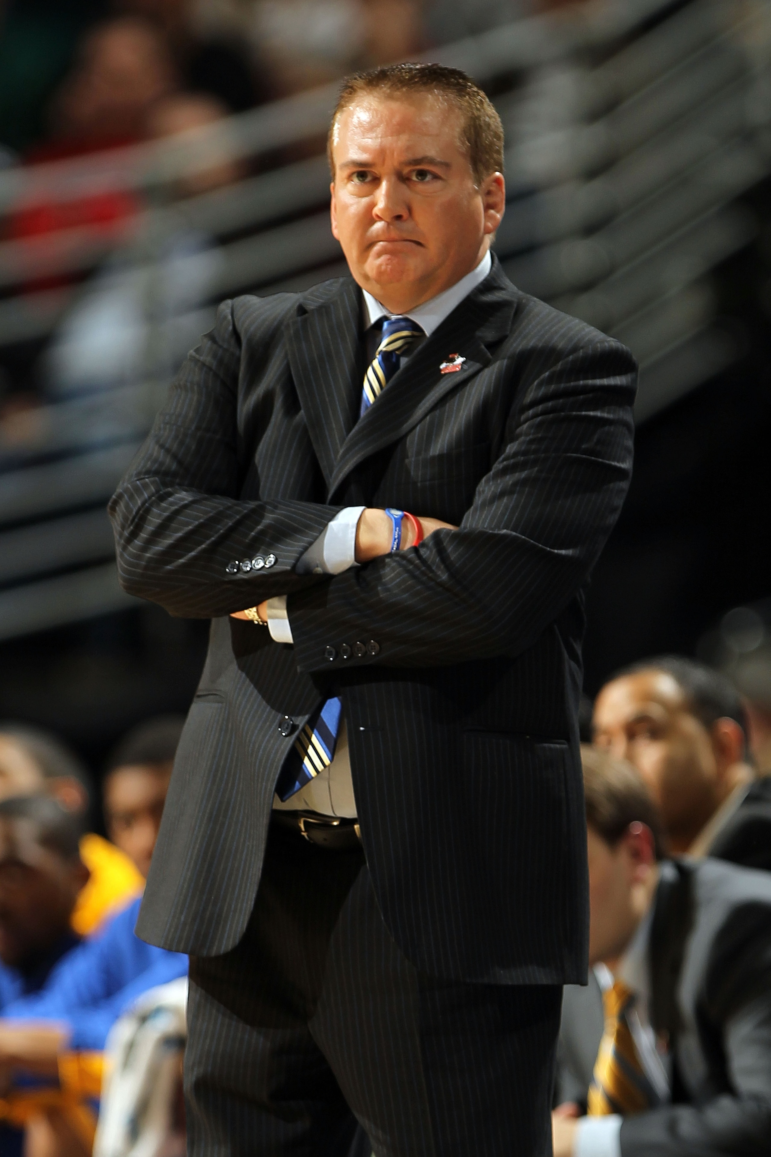DENVER, CO - MARCH 19:  Head coach Donnie Tyndall of the Morehead State Eagles looks on from the bench against the Richmond Spiders during the third round of the 2011 NCAA men's basketball tournament at Pepsi Center on March 19, 2011 in Denver, Colorado.