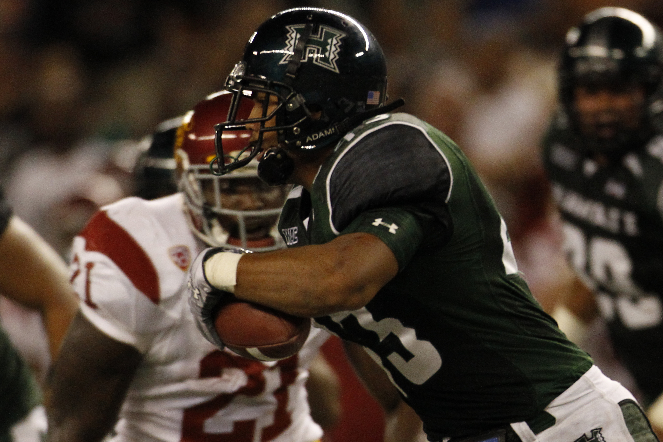 HONOLULU - SEPTEMBER 2:  Mana Silva of the University of Hawaii Warriors runs the ball after a USC fumble during second half action at Aloha Stadium September 2, 2010 in Honolulu, Hawaii. (Photo by Kent Nishimura/Getty Images)