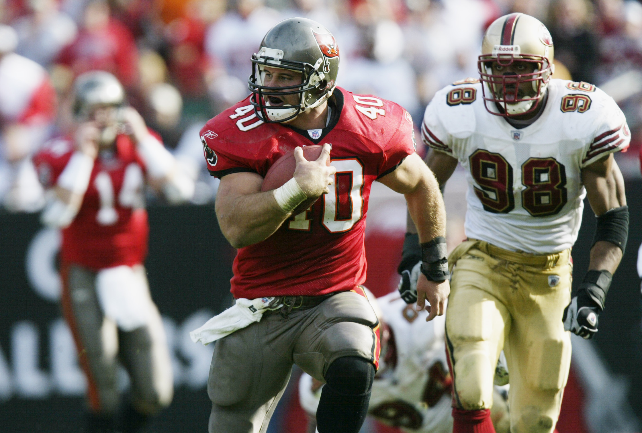 Tampa Bay Buccaneers' Mike Alstott points toward the stands after scoring a  touchdown on a 1-yard run against the Atlanta Falcons during the fourth  quarter Sunday, Dec. 5, 2004, at Raymond James