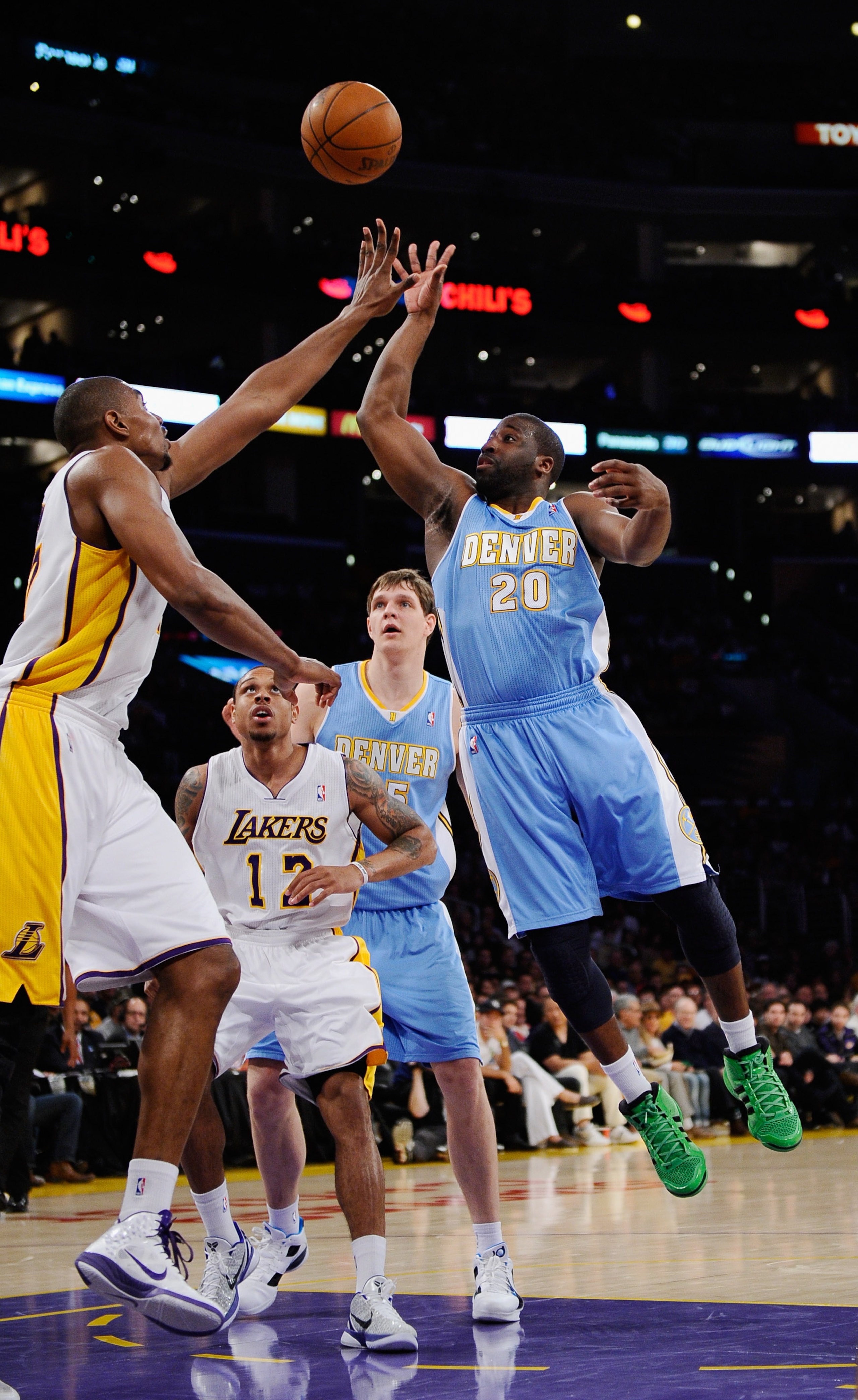 LOS ANGELES, CA - APRIL 03: Raymond Felton #20 of the Denver Nuggets shoots a basket over Andrew Bynum #17 of the Los Angeles Lakers during the NBA basketball game at Staples Center on April 3, 2011 in Los Angeles, California. NOTE TO USER: User expressl LOS ANGELES, CA - APRIL 03: Raymond Felton #20 of the Denver Nuggets shoots a basket over Andrew Bynum #17 of the Los Angeles Lakers during the NBA basketball game at Staples Center on April 3, 2011 in Los Angeles, California. NOTE TO USER: User expressl