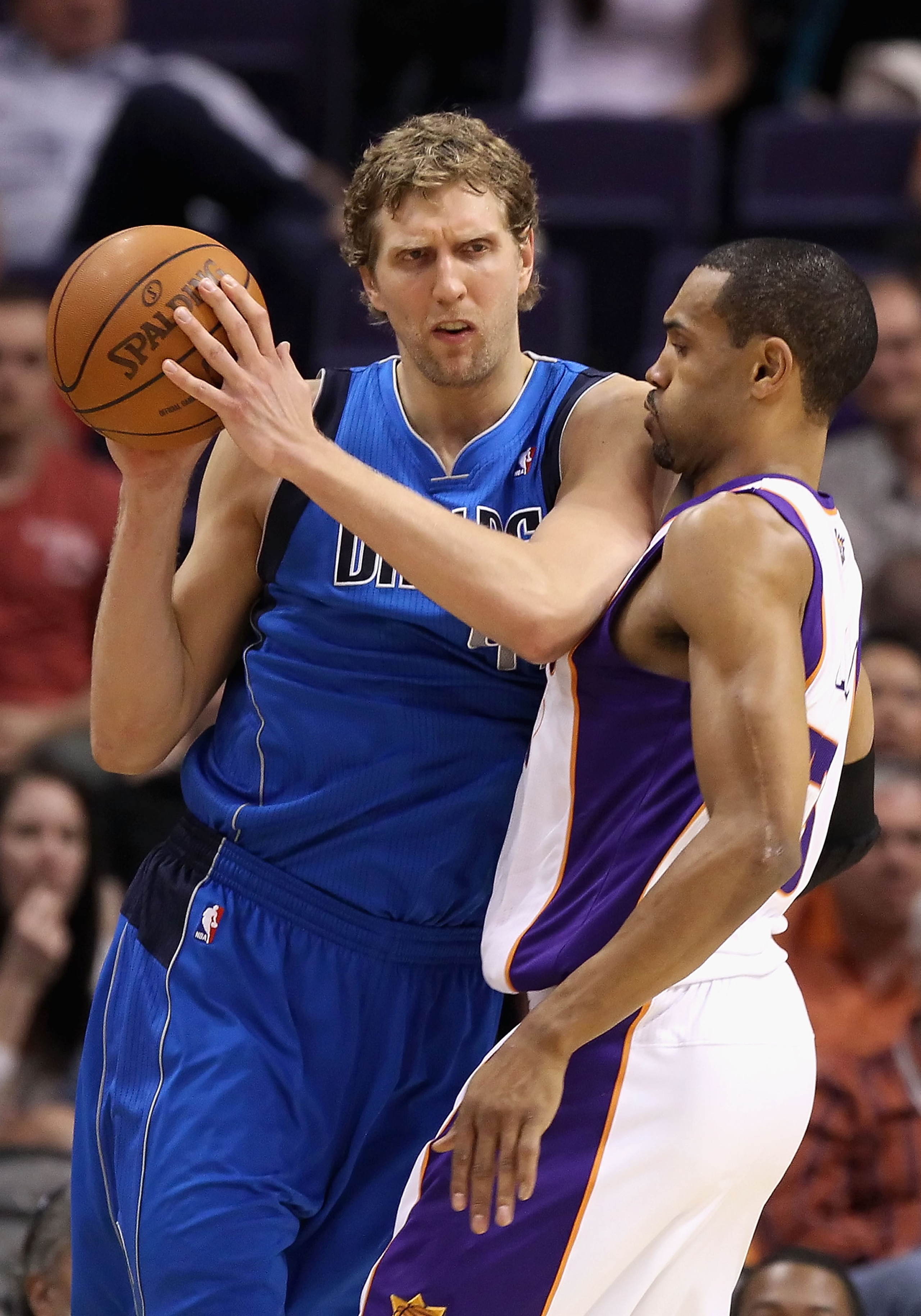 PHOENIX, AZ - MARCH 27: Dirk Nowitzki #41 of the Dallas Mavericks handles the ball under pressure from Grant Hill #33 of the Phoenix Suns during the NBA game at US Airways Center on March 27, 2011 in Phoenix, Arizona. The Mavericks defeated the Suns 91-8 PHOENIX, AZ - MARCH 27: Dirk Nowitzki #41 of the Dallas Mavericks handles the ball under pressure from Grant Hill #33 of the Phoenix Suns during the NBA game at US Airways Center on March 27, 2011 in Phoenix, Arizona. The Mavericks defeated the Suns 91-8