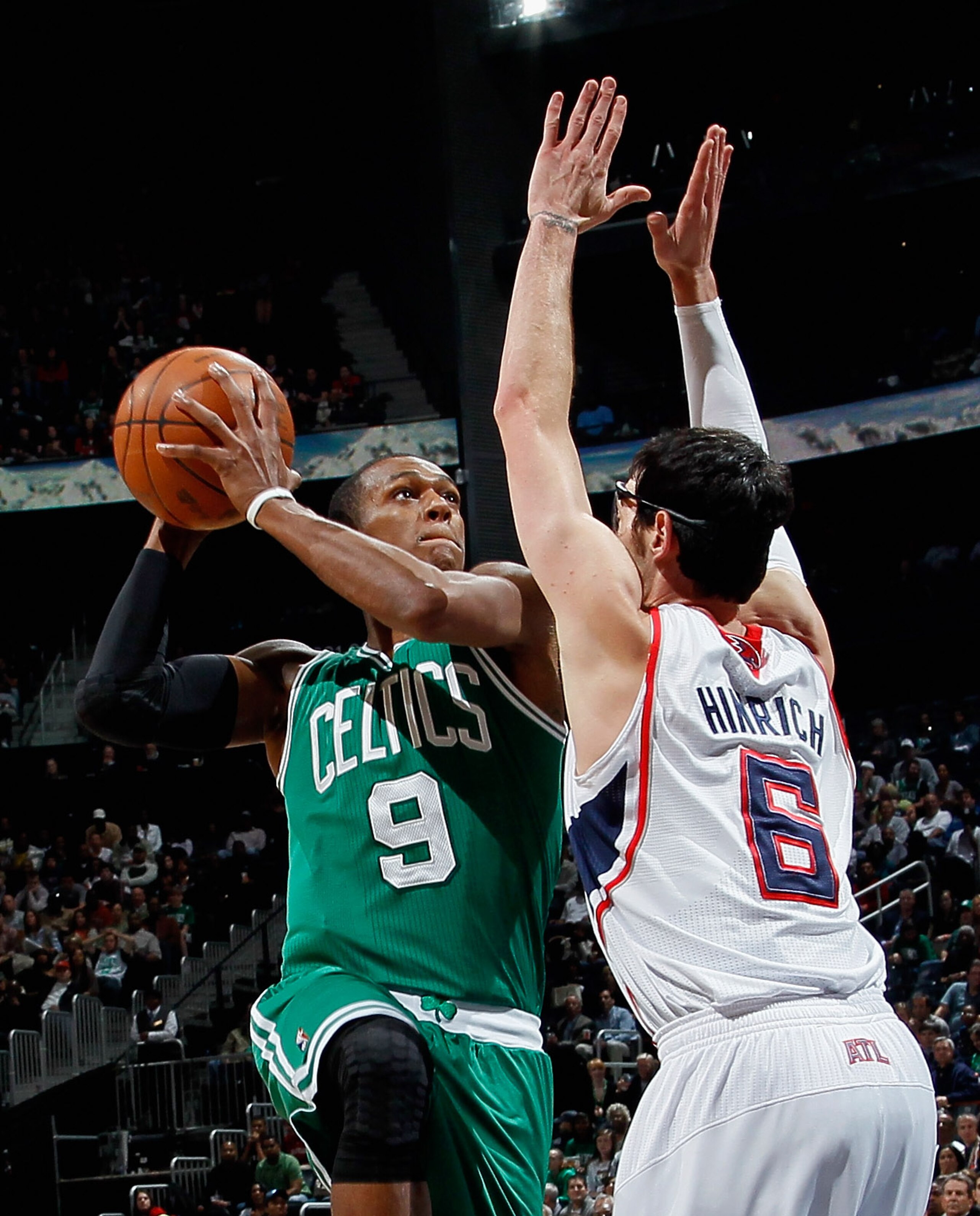 ATLANTA, GA - APRIL 01: Rajon Rondo #9 of the Boston Celtics shoots against Kirk Hinrich #6 of the Atlanta Hawks at Philips Arena on April 1, 2011 in Atlanta, Georgia. NOTE TO USER: User expressly acknowledges and agrees that, by downloading and/or usin ATLANTA, GA - APRIL 01: Rajon Rondo #9 of the Boston Celtics shoots against Kirk Hinrich #6 of the Atlanta Hawks at Philips Arena on April 1, 2011 in Atlanta, Georgia. NOTE TO USER: User expressly acknowledges and agrees that, by downloading and/or usin