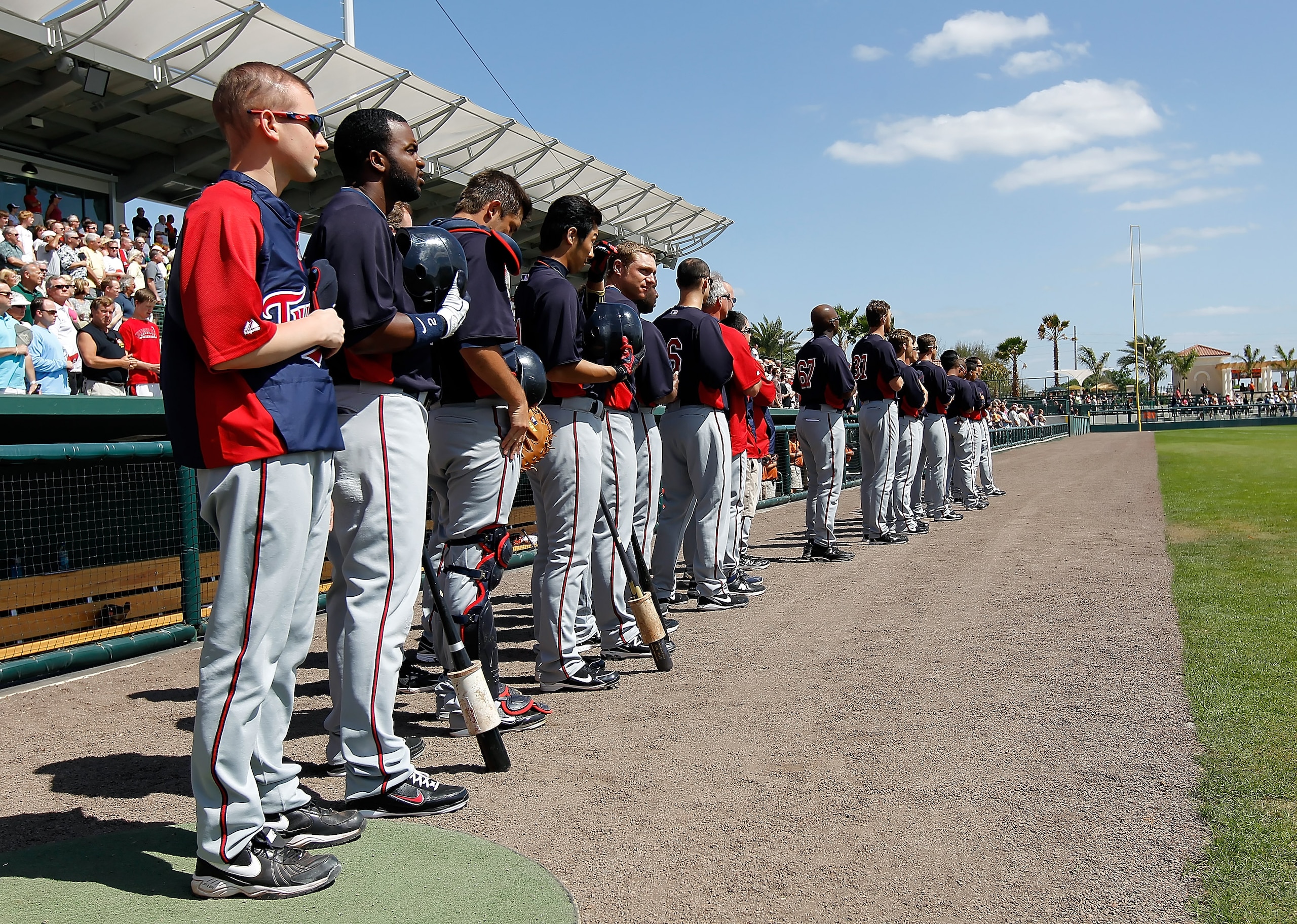 SARASOTA, FL - MARCH 03:  The Minnesota Twins line up for the National Anthem just before the start of the Grapefruit League Spring Training Game against the Baltimore Orioles at Ed Smith Stadium on March 3, 2011 in Sarasota, Florida.  (Photo by J. Meric/