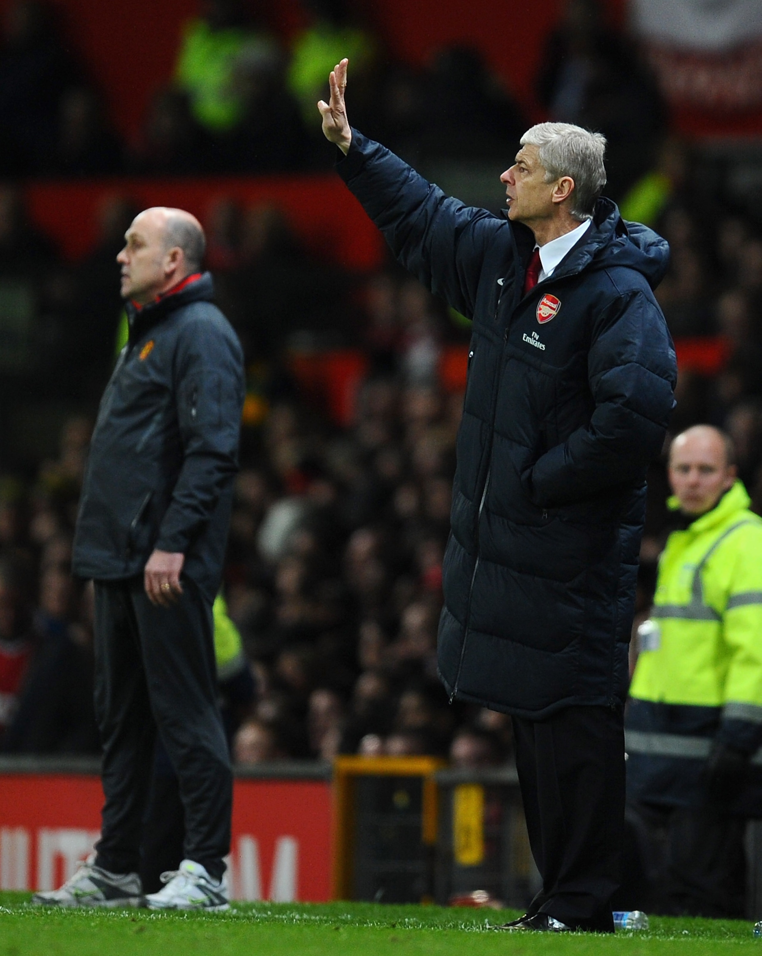 MANCHESTER, ENGLAND - MARCH 12:  Arsenal manager Arsene Wenger directs his team during the FA Cup sponsored by E.On Sixth Round match between Manchester United and Arsenal at Old Trafford on March 12, 2011 in Manchester, England.  (Photo by Clive Mason/Ge