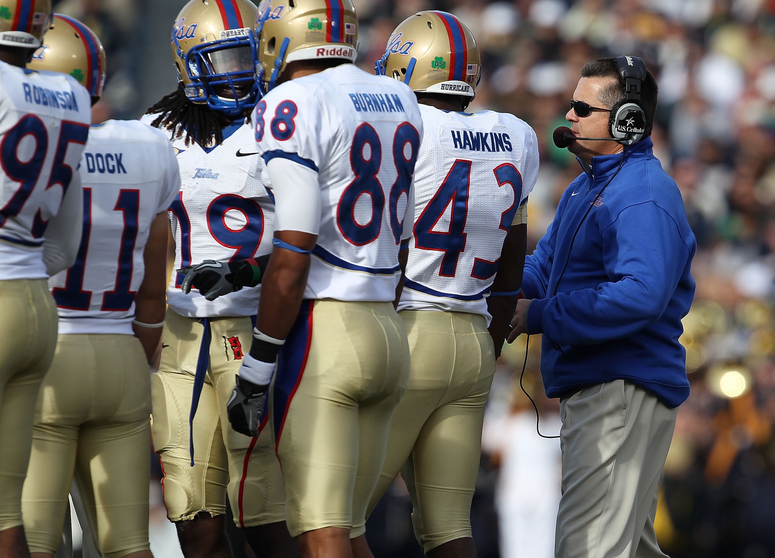 SOUTH BEND, IN - OCTOBER 30: Head coach Todd Graham of the Tulsa Golden Hurricane talks to his team including (L-R) Alan Dock #11, Milton Howell #19, Bryan Burnham #88 and Donnell Hawkins #43 during a game against the Notre Dame Fighting Irish at Notre Da SOUTH BEND, IN - OCTOBER 30: Head coach Todd Graham of the Tulsa Golden Hurricane talks to his team including (L-R) Alan Dock #11, Milton Howell #19, Bryan Burnham #88 and Donnell Hawkins #43 during a game against the Notre Dame Fighting Irish at Notre Da