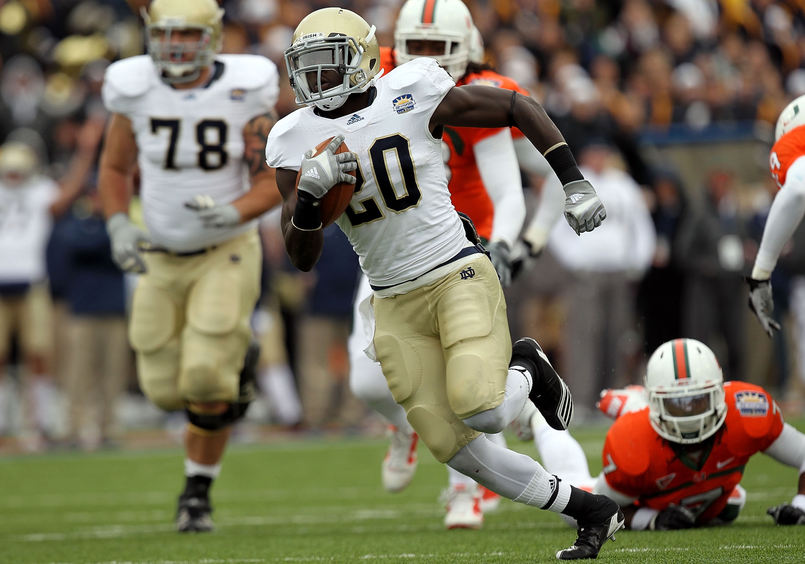EL PASO, TX - DECEMBER 30: Running back Cierre Wood #20 of the Notre Dame Fighting Irish runs for a touchdown against the Miami Hurricanes during the Hyundai Sun Bowl at Sun Bowl on December 30, 2010 in El Paso, Texas. (Photo by Ronald Martinez/Getty Im EL PASO, TX - DECEMBER 30: Running back Cierre Wood #20 of the Notre Dame Fighting Irish runs for a touchdown against the Miami Hurricanes during the Hyundai Sun Bowl at Sun Bowl on December 30, 2010 in El Paso, Texas. (Photo by Ronald Martinez/Getty Im