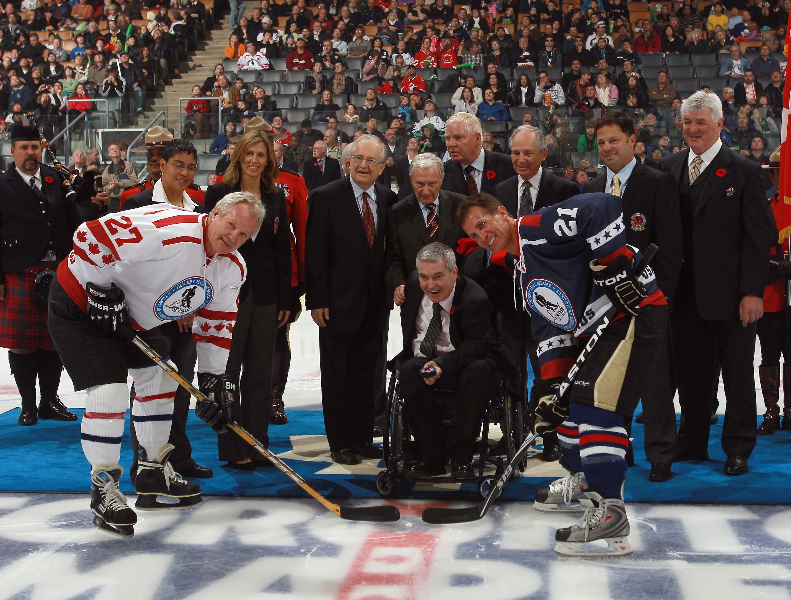 TORONTO, ON - NOVEMBER 07: Hall of Fame inductees take part in the ceremonial faceoff between Darryl Sittler #27 and Tony Granato #21 prior to the Legends Classic Hockey Game at the Air Canada Centre on November 7, 2010 in Toronto, Canada.  (Photo by Bruc