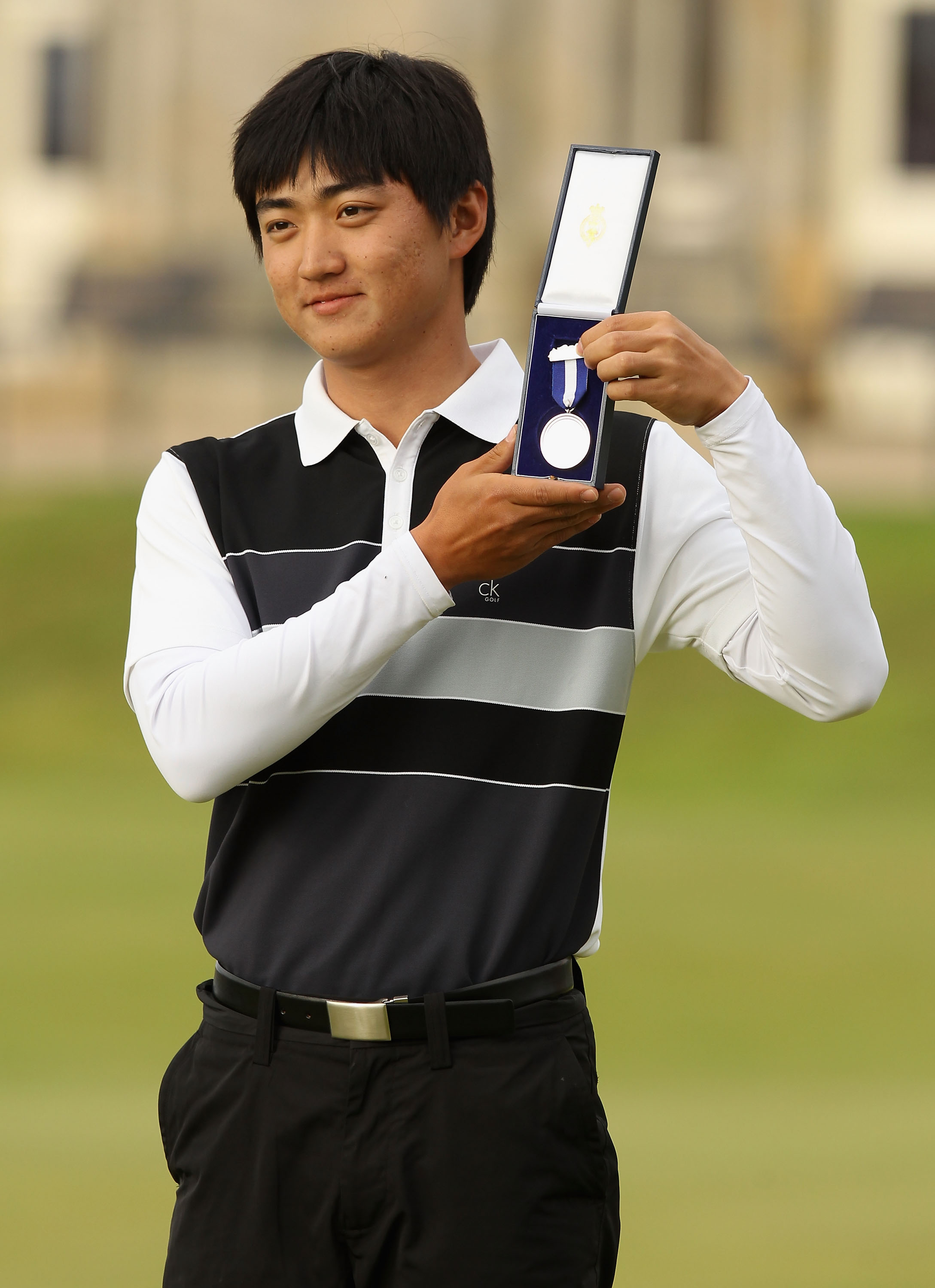 ST ANDREWS, SCOTLAND - JULY 18:  Amateur Jin Jeong of South Korea poses with the silver medal for the highest placed amateur after the final round of the 139th Open Championship on the Old Course, St Andrews on July 18, 2010 in St Andrews, Scotland.  (Pho