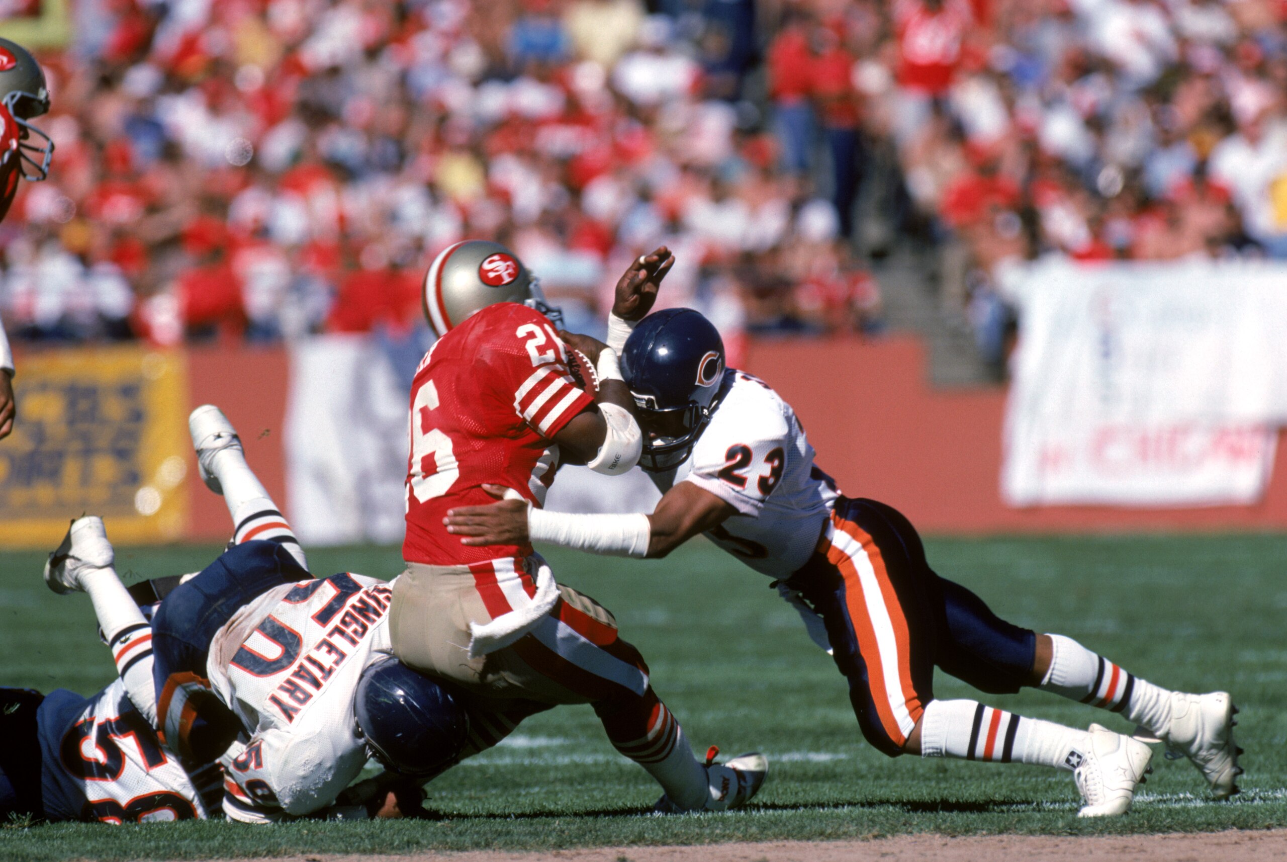 SAN FRANCISCO - OCTOBER 13:  Safety Shaun Gayle #23 of the Chicago Bears tackles running back Wendell Tyler #26 of the San Francisco 49ers during a game at Candlestick Park on October 13, 1985 in San Francisco, California.  The Bears won 26-10.   (Photo b