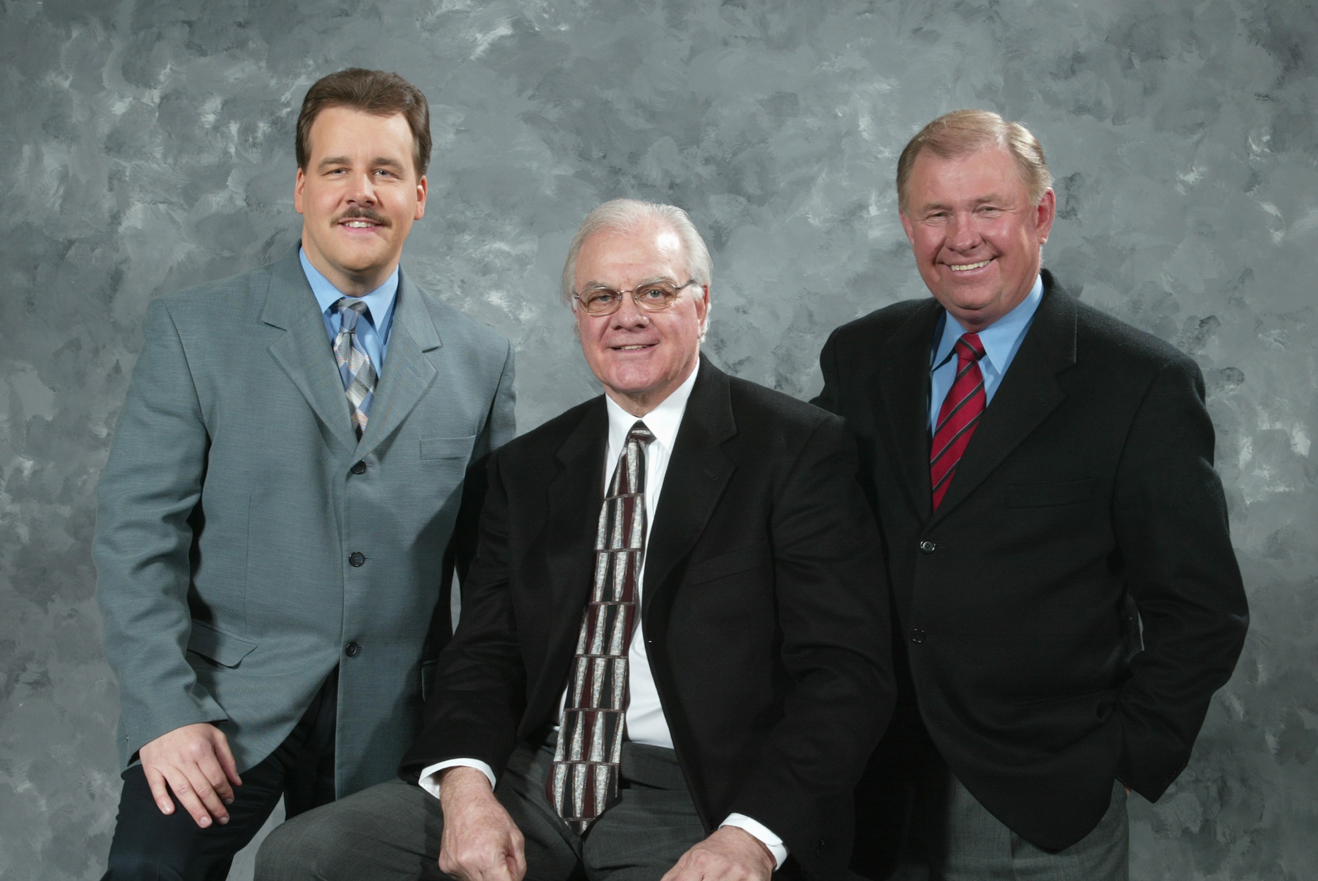 PHILADELPHIA - MARCH 2:  (L-R) Philadelphia Flyers TV broadcasters Jim Jackson, Gary Dornhoefer and Steve Coates pose for a photo before the game against the New York Rangers at the Wachovia Center on March 2, 2006 in Philadelphia, Pennsylvania. The Range