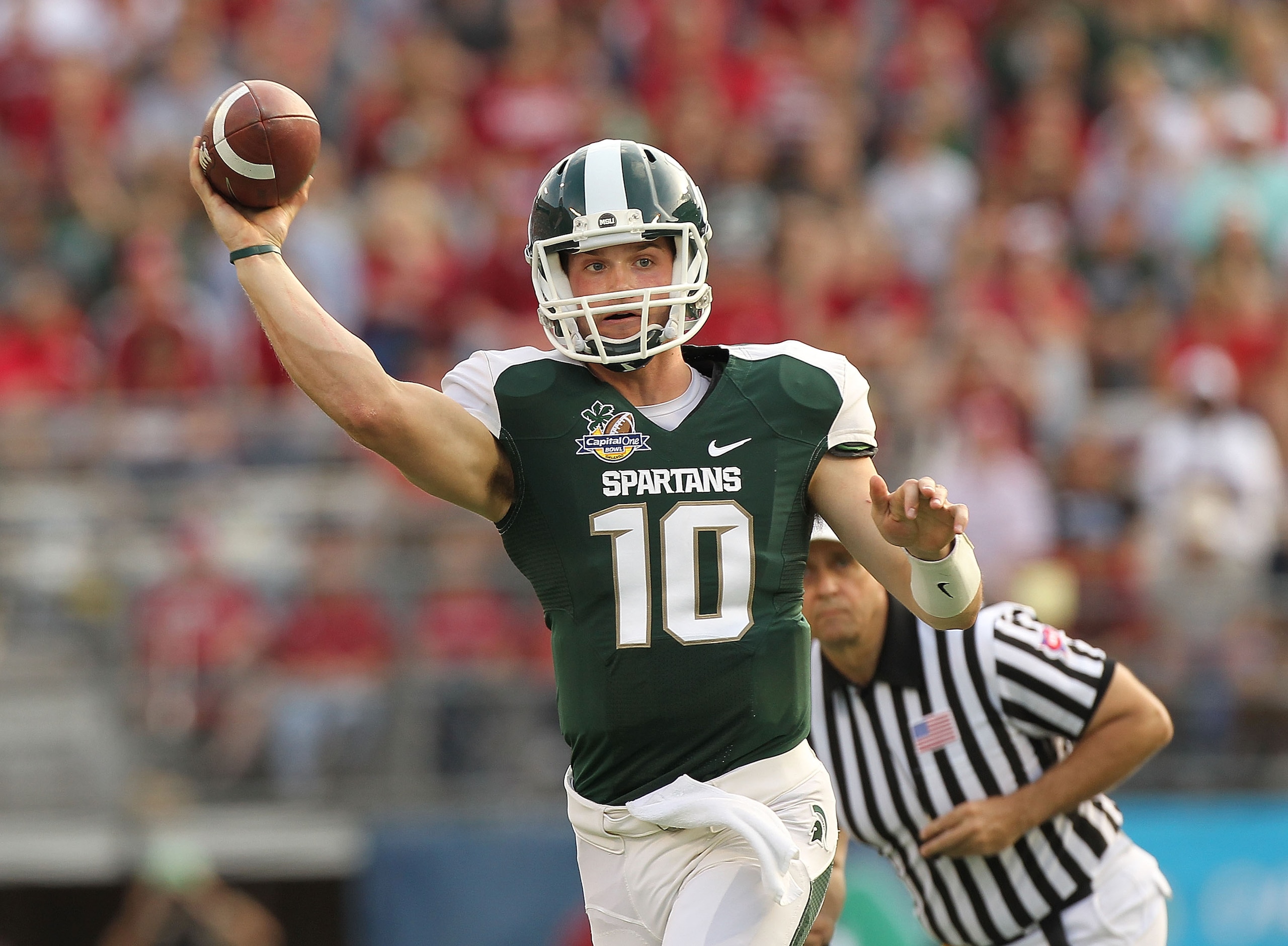 ORLANDO, FL - JANUARY 01: Andrew Maxwell #10 of the Michigan State Spartans passes the ball during the Capitol One Bowl against the Alabama Crimson Tide at the Florida Citrus Bowl on January 1, 2011 in Orlando, Florida. (Photo by Mike Ehrmann/Getty Image ORLANDO, FL - JANUARY 01: Andrew Maxwell #10 of the Michigan State Spartans passes the ball during the Capitol One Bowl against the Alabama Crimson Tide at the Florida Citrus Bowl on January 1, 2011 in Orlando, Florida. (Photo by Mike Ehrmann/Getty Image