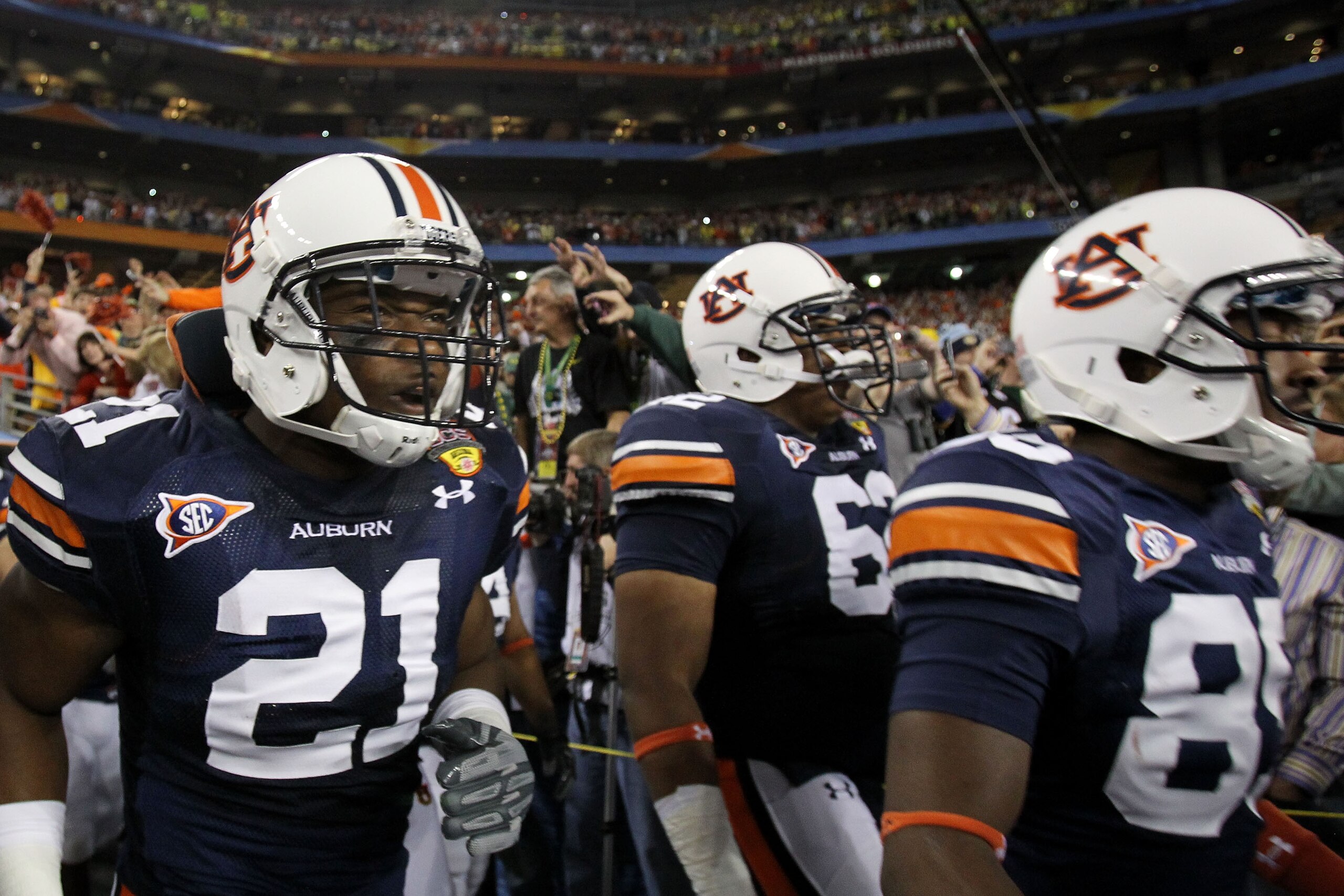 GLENDALE, AZ - JANUARY 10: Eltoro Freeman #21, Chad Slade #62 and Travante Stallworth #85 of the Auburn Tigers take the field against the Oregon Ducks during the Tostitos BCS National Championship Game at University of Phoenix Stadium on January 10, 2011 GLENDALE, AZ - JANUARY 10: Eltoro Freeman #21, Chad Slade #62 and Travante Stallworth #85 of the Auburn Tigers take the field against the Oregon Ducks during the Tostitos BCS National Championship Game at University of Phoenix Stadium on January 10, 2011
