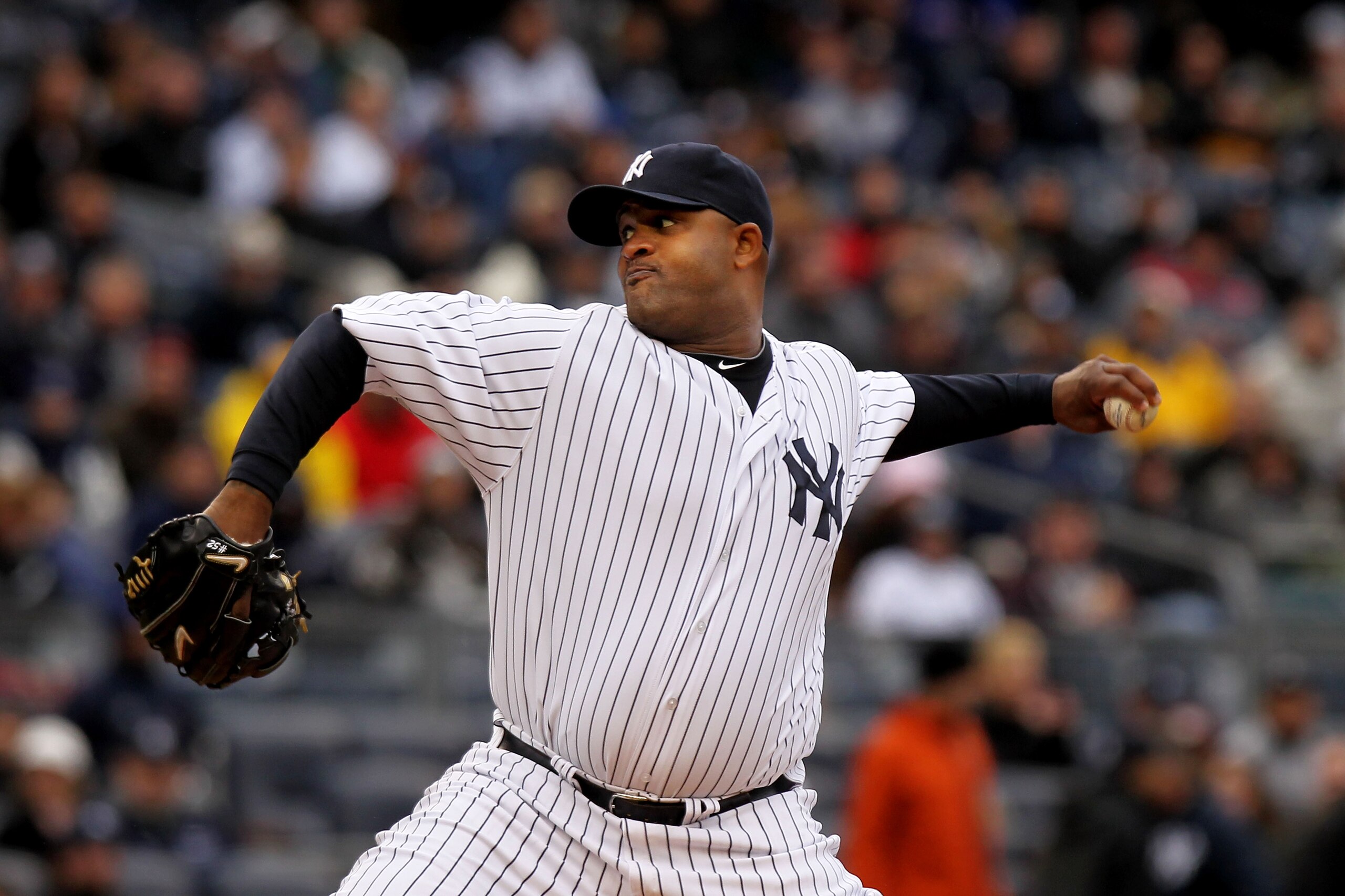 NEW YORK, NY - MARCH 31:  CC Sabathia #52 of the New York Yankees throws a pitch during the first inning against the Detroit Tigers on Opening Day at Yankee Stadium on March 31, 2011 in New York City.  (Photo by Nick Laham/Getty Images)