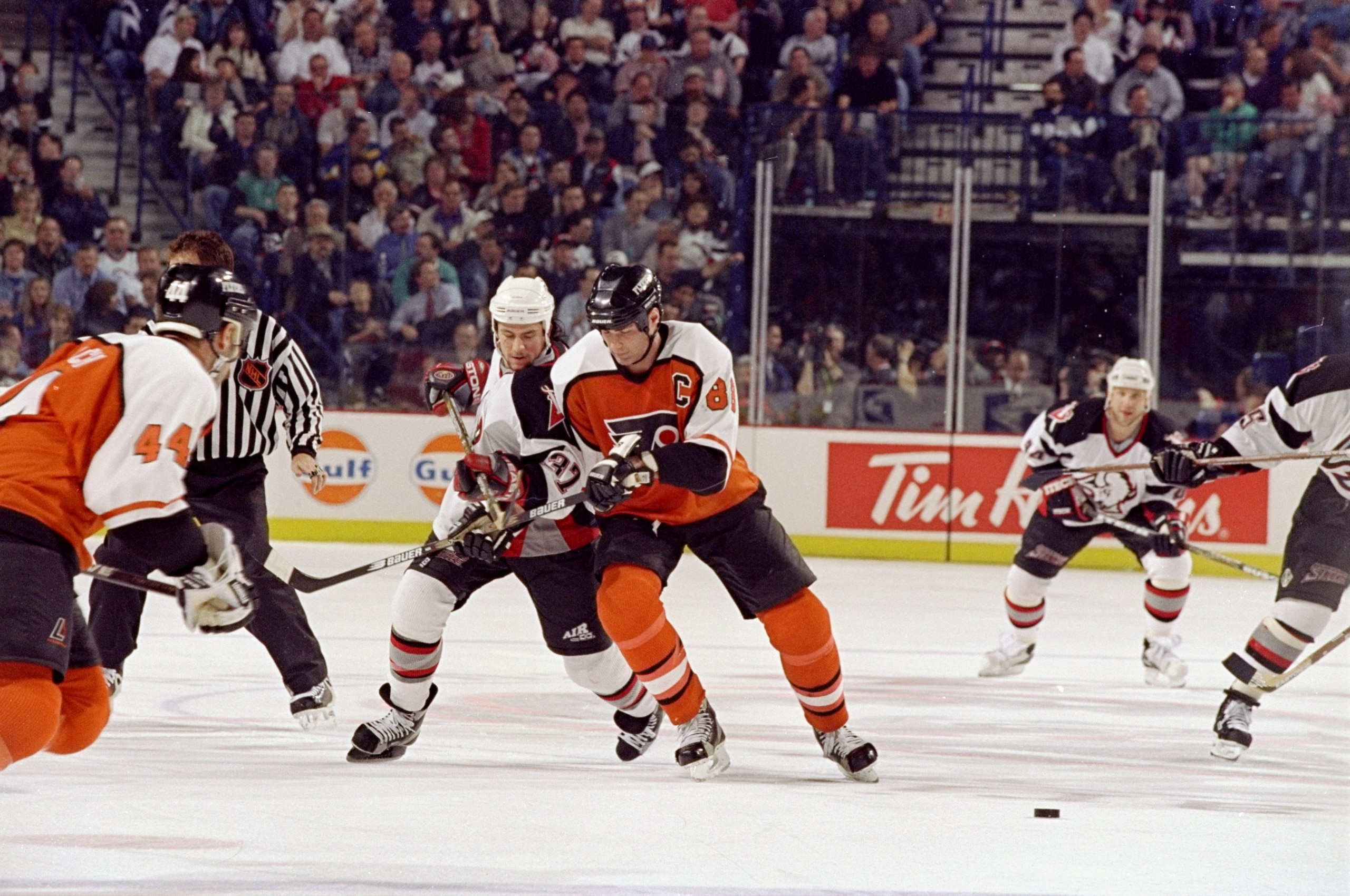 29 Apr 1998:  Leftwinger Curtis Brown of the Buffalo Sabres in action against center Eric Lindros of the Philadelphia Flyers during an NHL playoff game at the Marine Midland Arena in Buffalo, New York.  The Sabres defeated the Flyers 4-1. Mandatory Credit