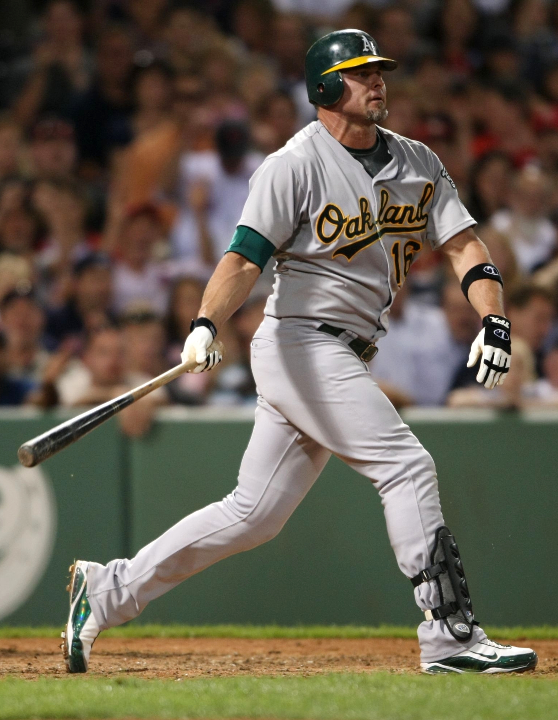 BOSTON - JULY 6:   Jason Giambi #16 of the Oakland Athletics strikes out against the Boston Red Sox at Fenway Park on July 6, 2009 in Boston, Massachusetts. (Photo by Elsa/Getty Images)