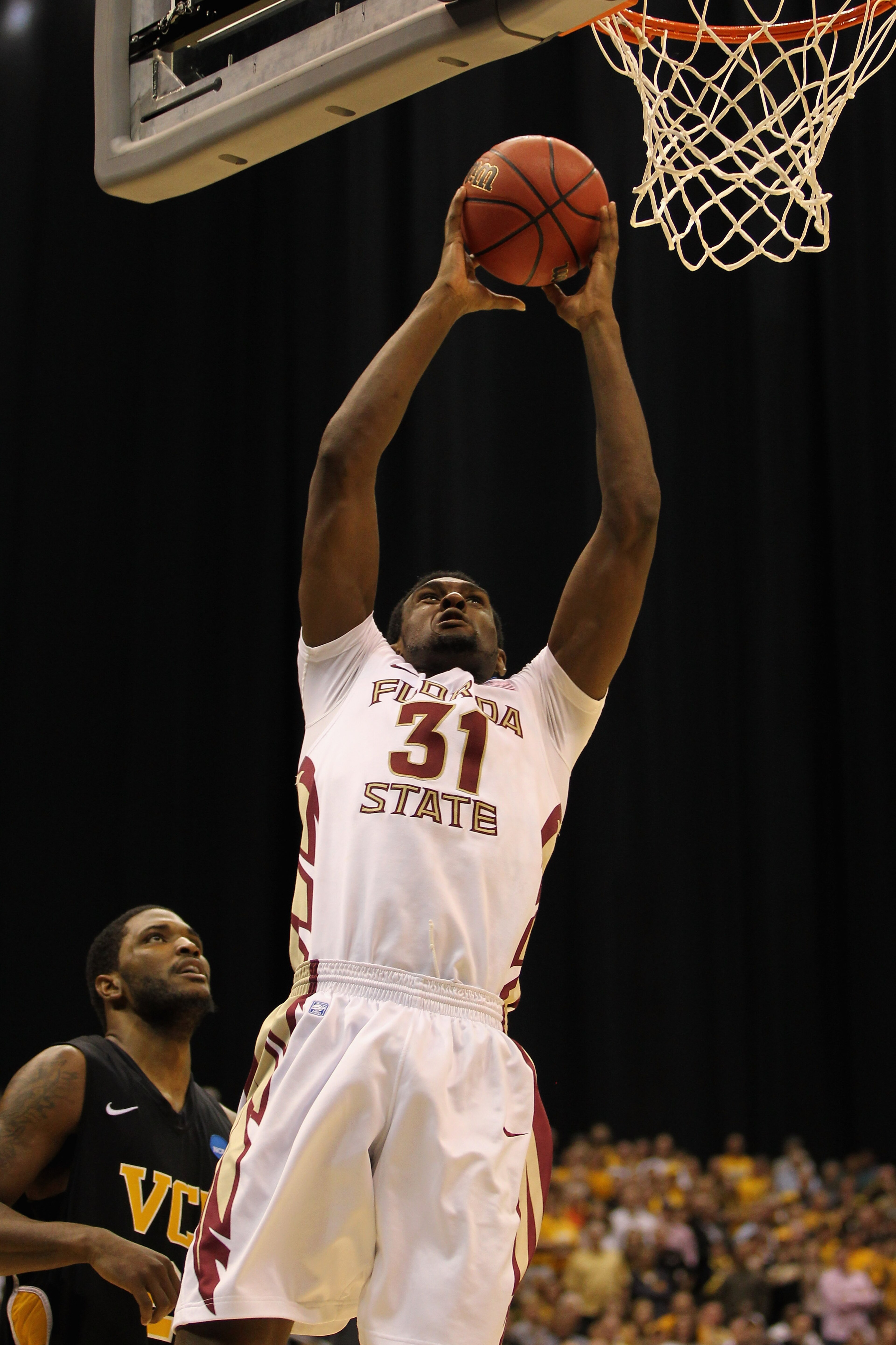 SAN ANTONIO, TX - MARCH 25:  Chris Singleton #31 of the Florida State Seminoles goes to the basket against Jamie Skeen #21 of the Virginia Commonwealth Rams during the southwest regional of the 2011 NCAA men's basketball tournament at the Alamodome on Mar