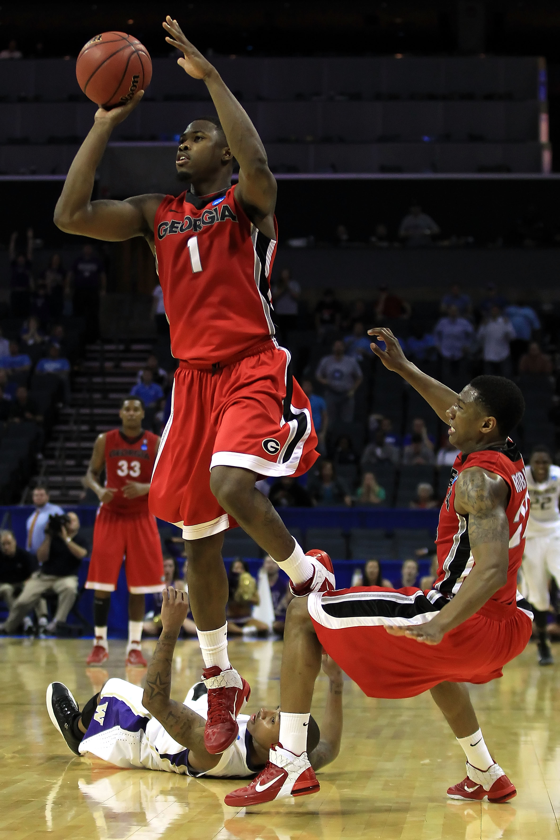 CHARLOTTE, NC - MARCH 18:  Travis Leslie #1 of the Georgia Bulldogs misses a last second three-pointer that would have tied the game against the Washington Huskies during the second round of the 2011 NCAA men's basketball tournament at Time Warner Cable A