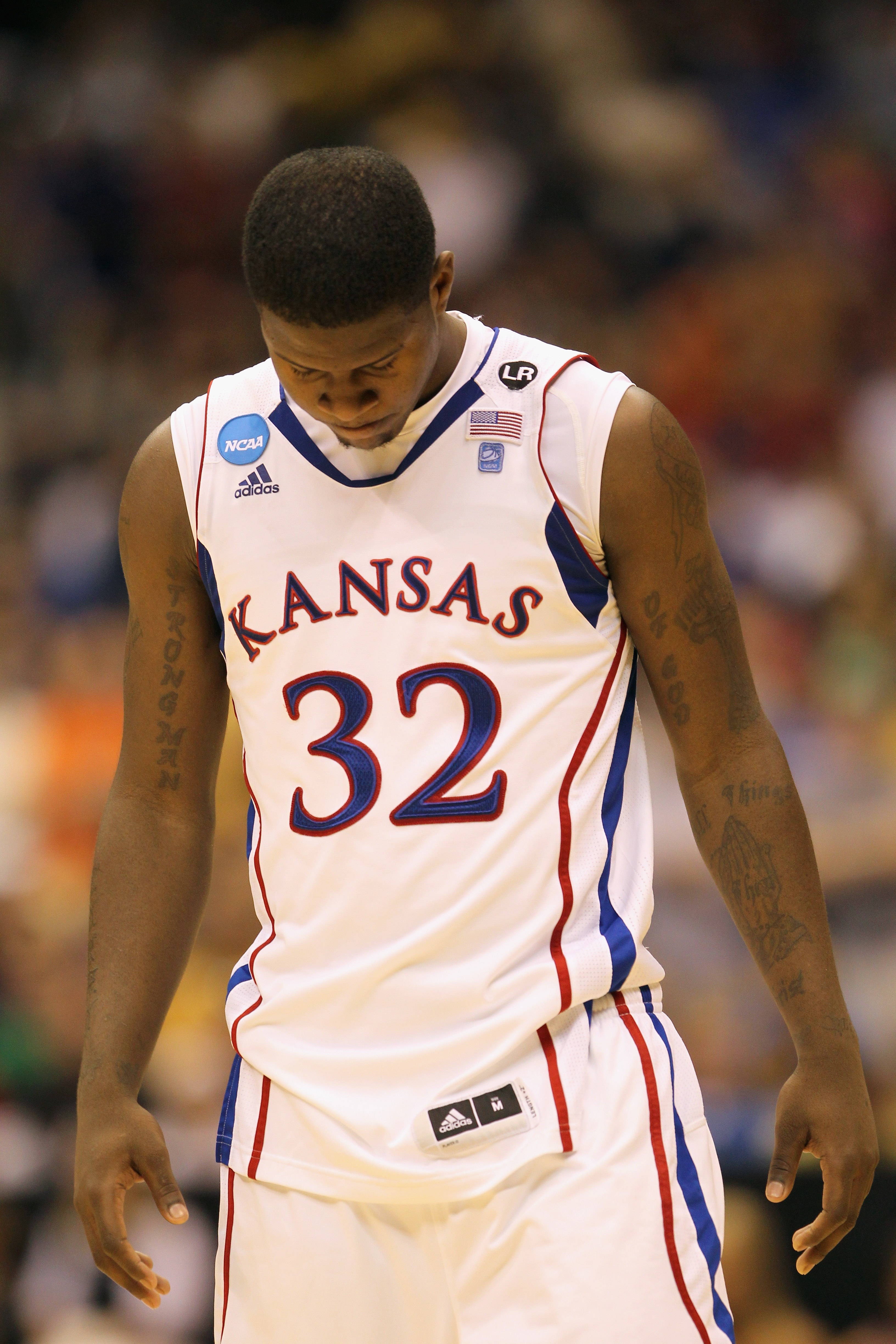 SAN ANTONIO, TX - MARCH 27:  Josh Selby #32 of the Kansas Jayhawks reacts after the southwest regional final of the 2011 NCAA men's basketball tournament against the Virginia Commonwealth Rams at the Alamodome on March 27, 2011 in San Antonio, Texas. Virg