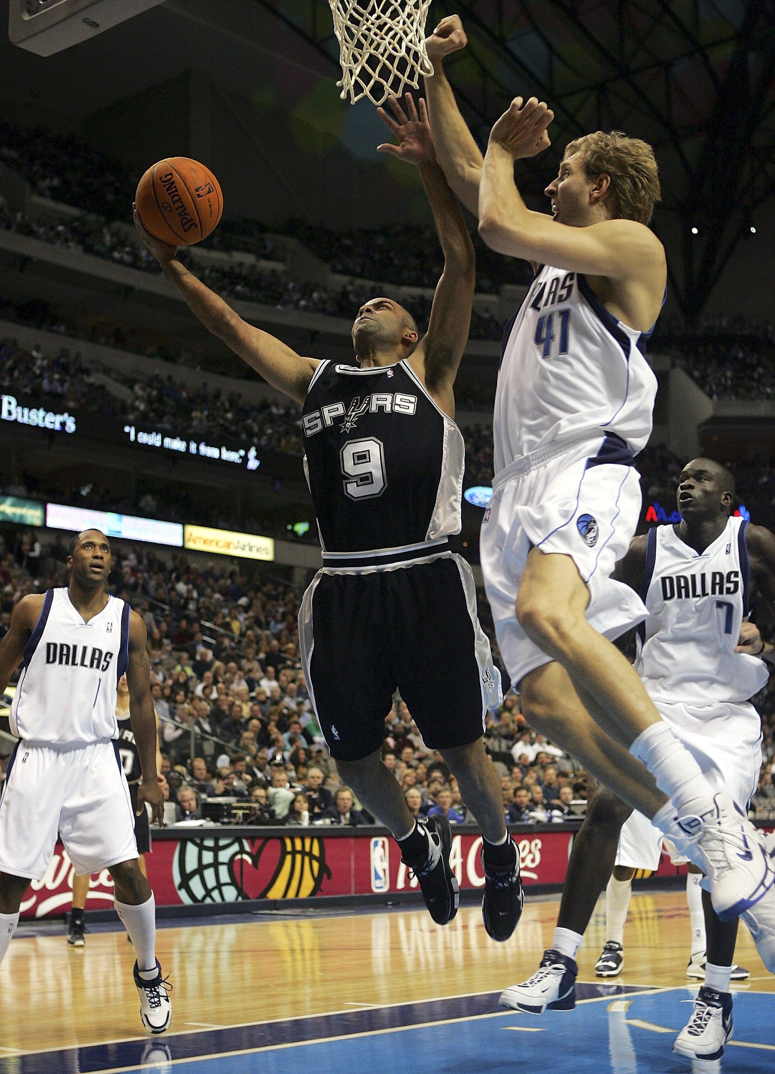 DALLAS - NOVEMBER 02: Guard Tony Parker #9 of the San Antonio Spurs takes a shot against Dirk Nowitzki #41 of the Dallas Mavericks at the American Airlines Center on November 2, 2006 in Dallas, Texas. NOTE TO USER: User expressly acknowledges and agrees t