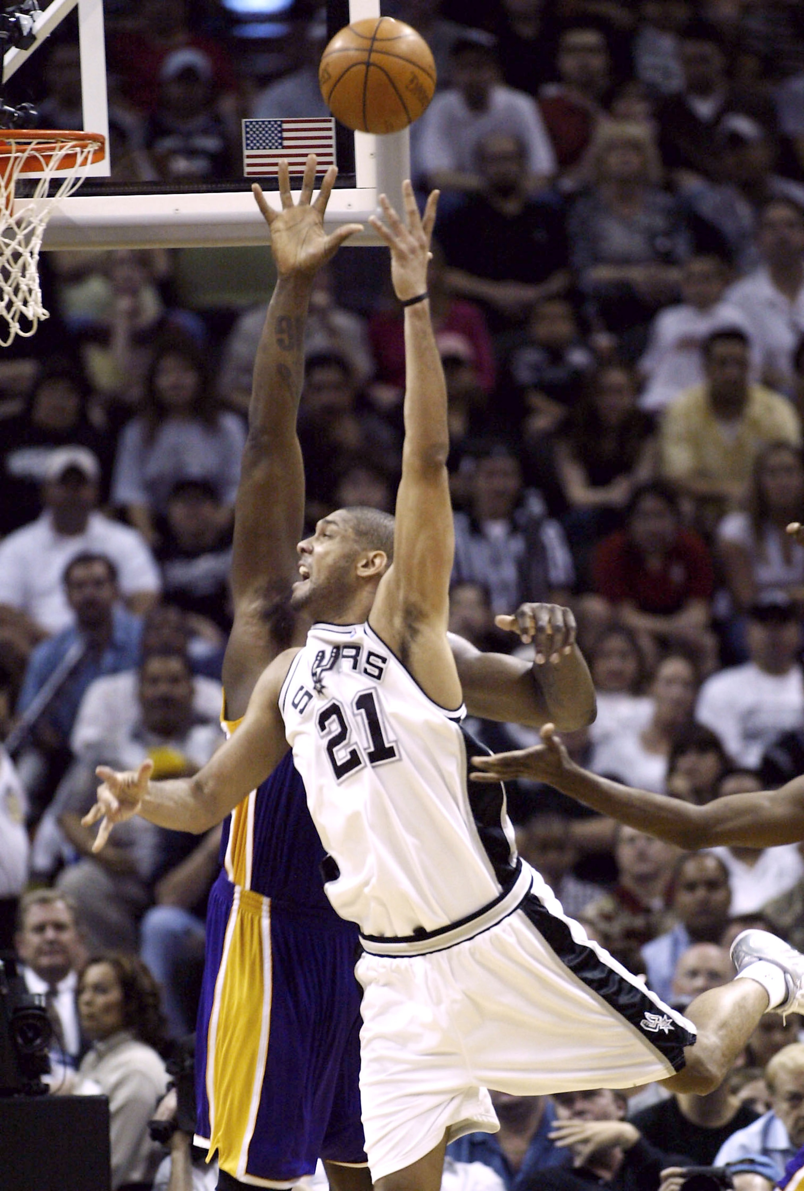 SAN ANTONIO - MAY 2:  Tim Duncan #21 of the San Antonio Spurs shoots over Shaquille O'Neal #34 of the Los Angeles Lakers during game one of the Western Conference Semifinals during the 2004 NBA Playoffs on May 2, 2004 at the SBC Center in San Antonio, Tex