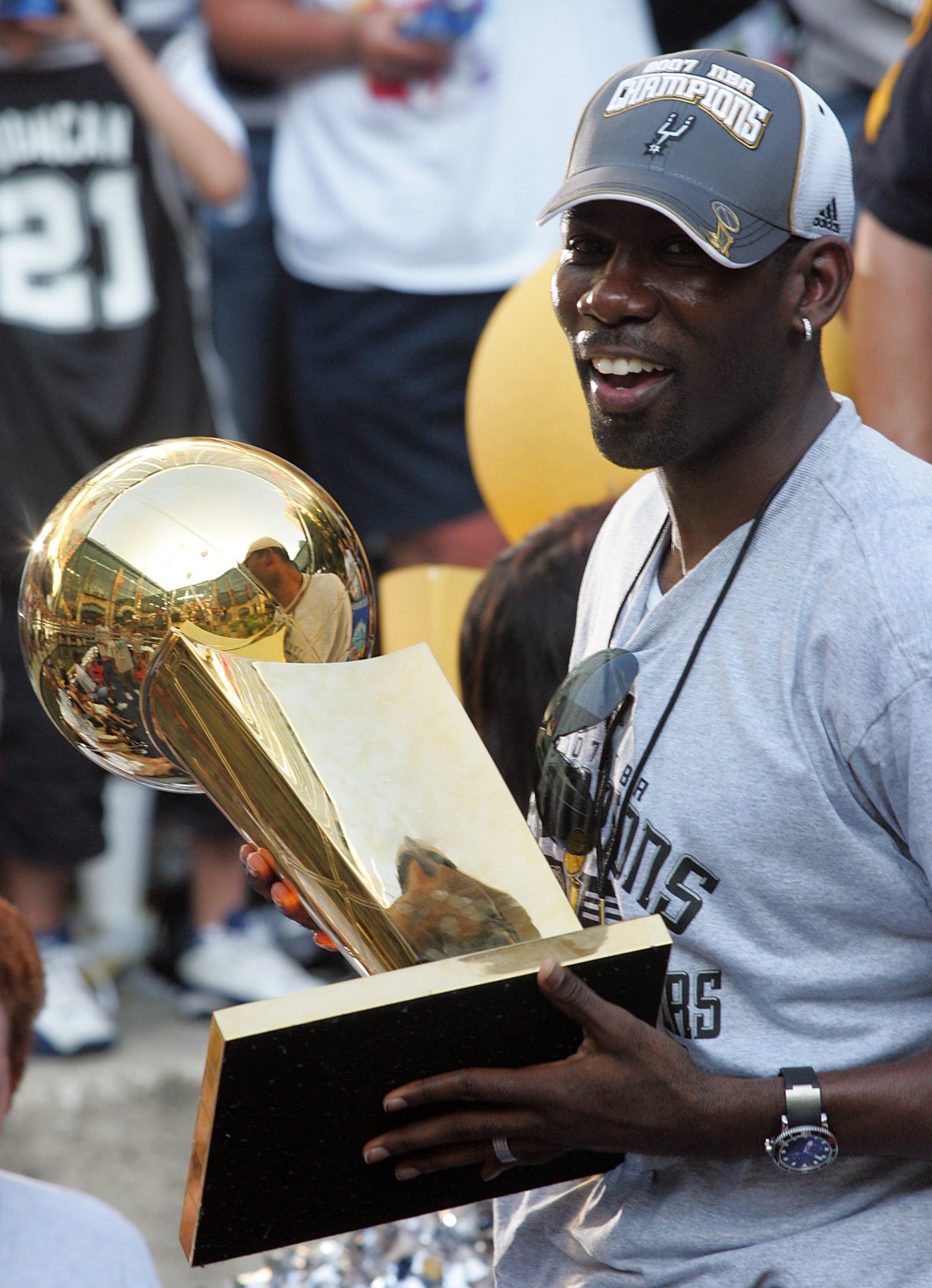 SAN ANTONIO - JUNE 17:  Michael Finley of the San Antonio Spurs holds the Larry O'Brien Championship trophy during the NBA championship parade down the San Antonio River walk June 17, 2007 in San Antonio, Texas. NOTE TO USER: User expressly acknowledges a