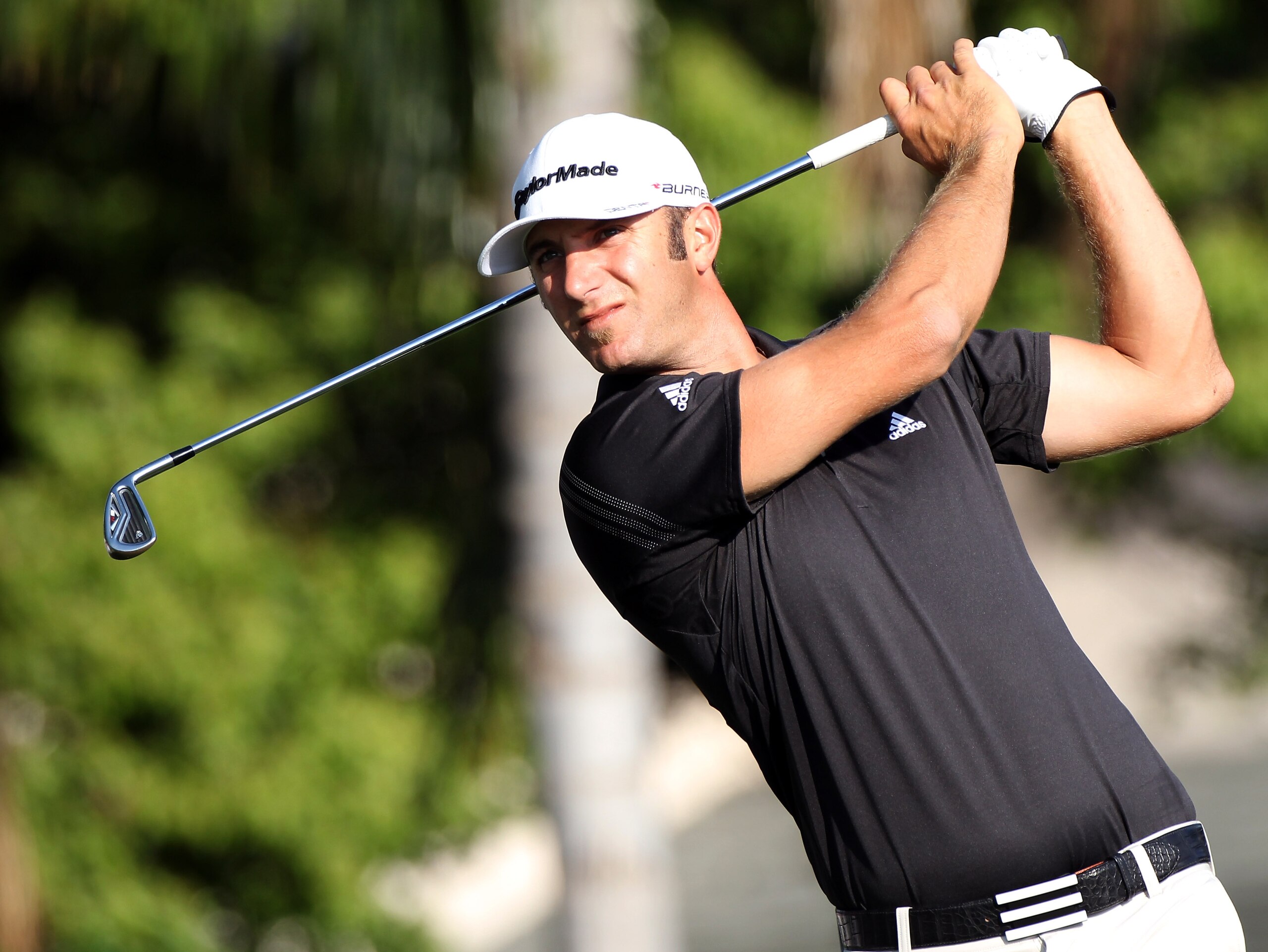 ORLANDO, FL - MARCH 25:  Dustin Johnson plays a shot on the 13th hole during the second round of the Bay Hill Invitational presented by MasterCard at the Bay Hill Club and Lodge on March 25, 2011 in Orlando, Florida.  (Photo by Sam Greenwood/Getty Images)
